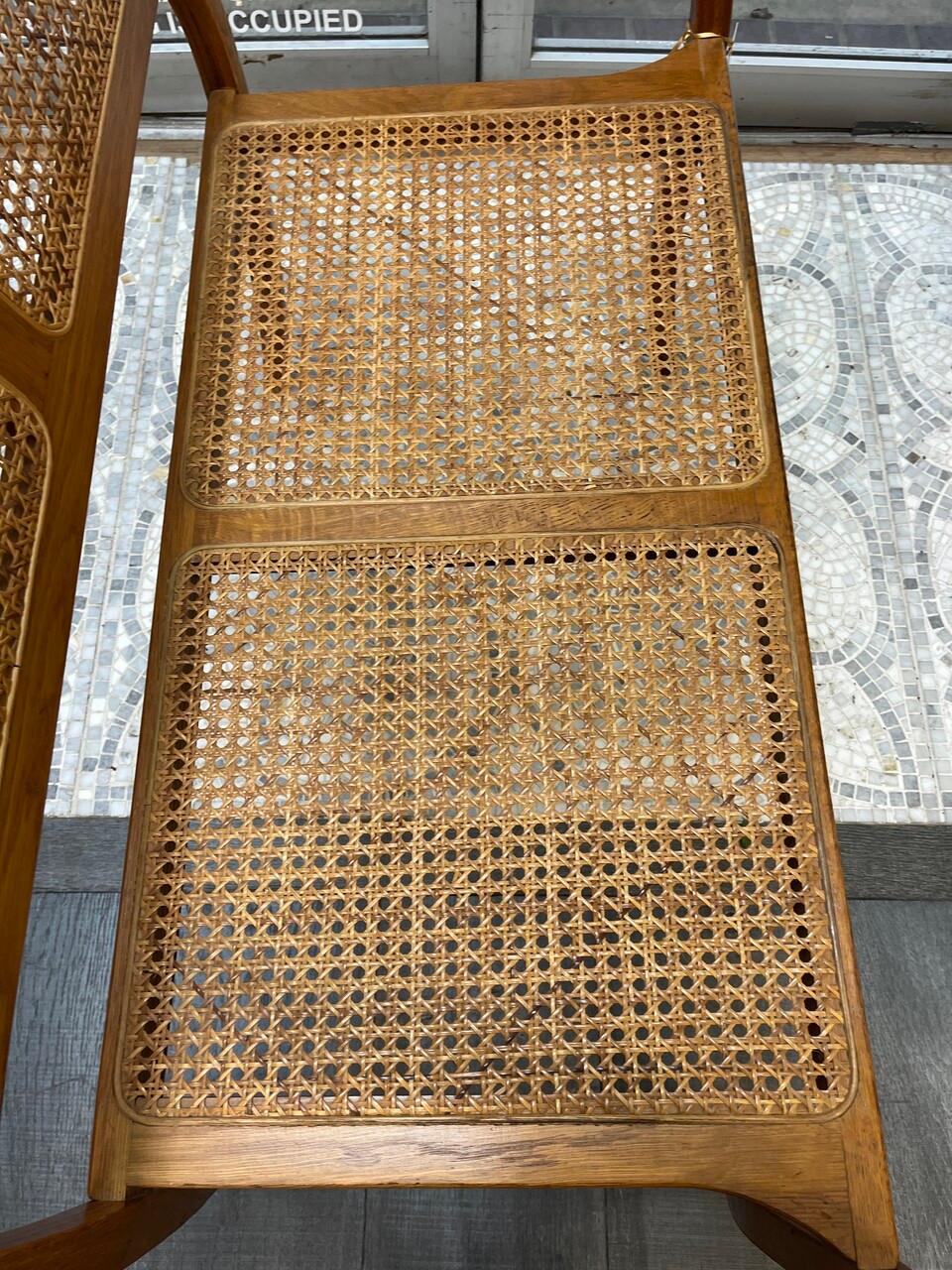 Mid-century beautifully grained oak settee, bench or loveseat with bentwood arms and caned back and seat. Seat, 18