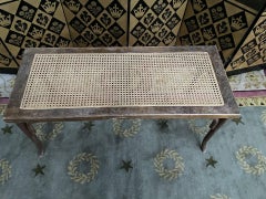 Caned piano bench