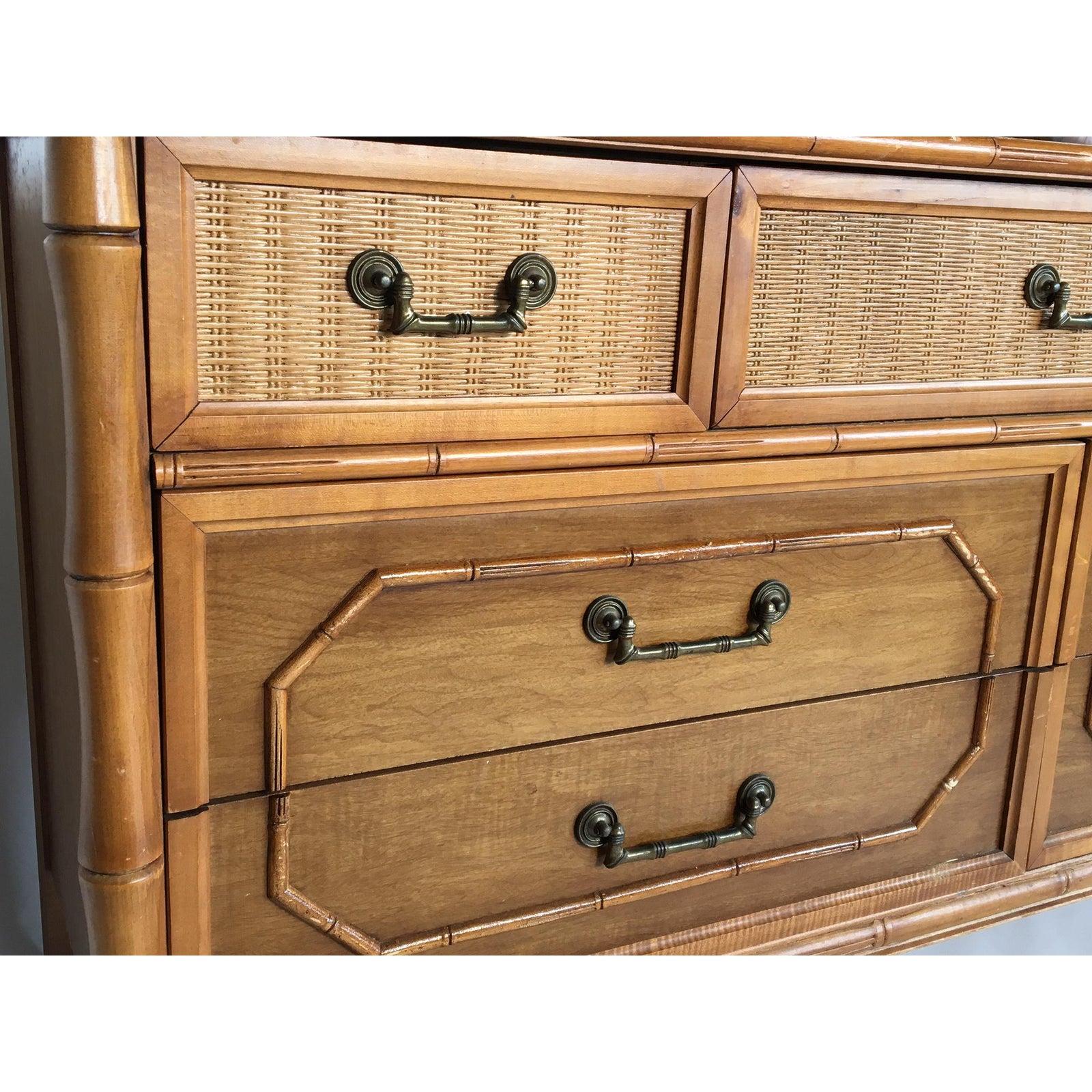 Beautifully crafted Broyhill dresser features bamboo styling and a cane detail inset along top front drawers.
Very good vintage condition with minor abrasions consistent with age. Aged brass drawer pulls and hardware.
Dovetail jointed drawers with