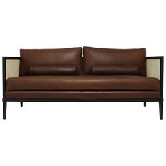 Caned Settee with Leather Back and Seat Cushions with Wood Frame