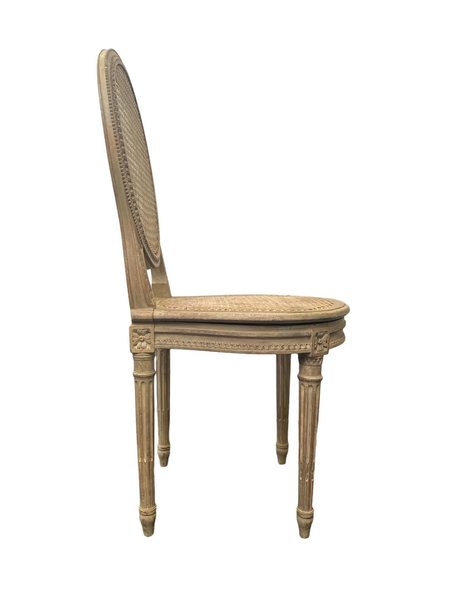 Caned balloon back side chair in the Louis XVI Style. The cane is in good condition and the chair still has its original patina. 

Property from esteemed interior designer Juan Montoya. Juan Montoya is one of the most acclaimed and prolific interior