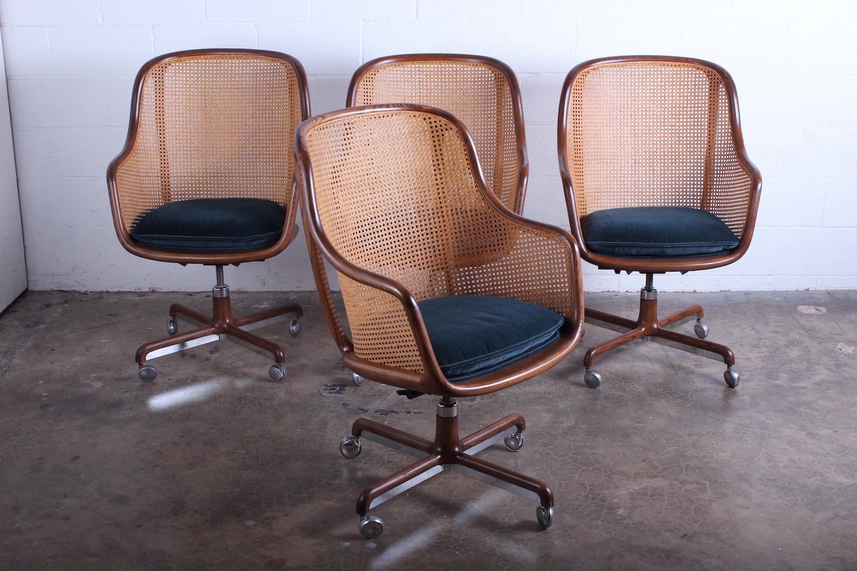 A fully caned swivel/tilt desk chair with ash frame and mohair seat. Designed by Ward Bennett for Brickel.