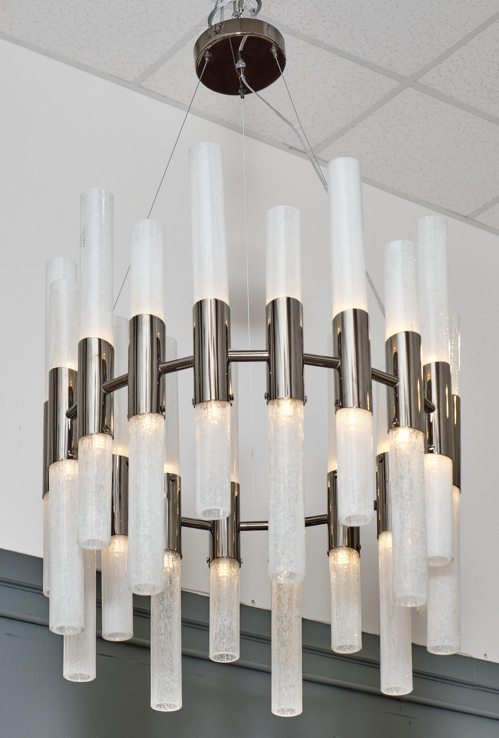 Contemporary Murano glass “canele” chandelier with multiple frosted glass tubes and a chrome structure. This piece has been newly wired to US standards.

The current height from the ceiling is 41.75
