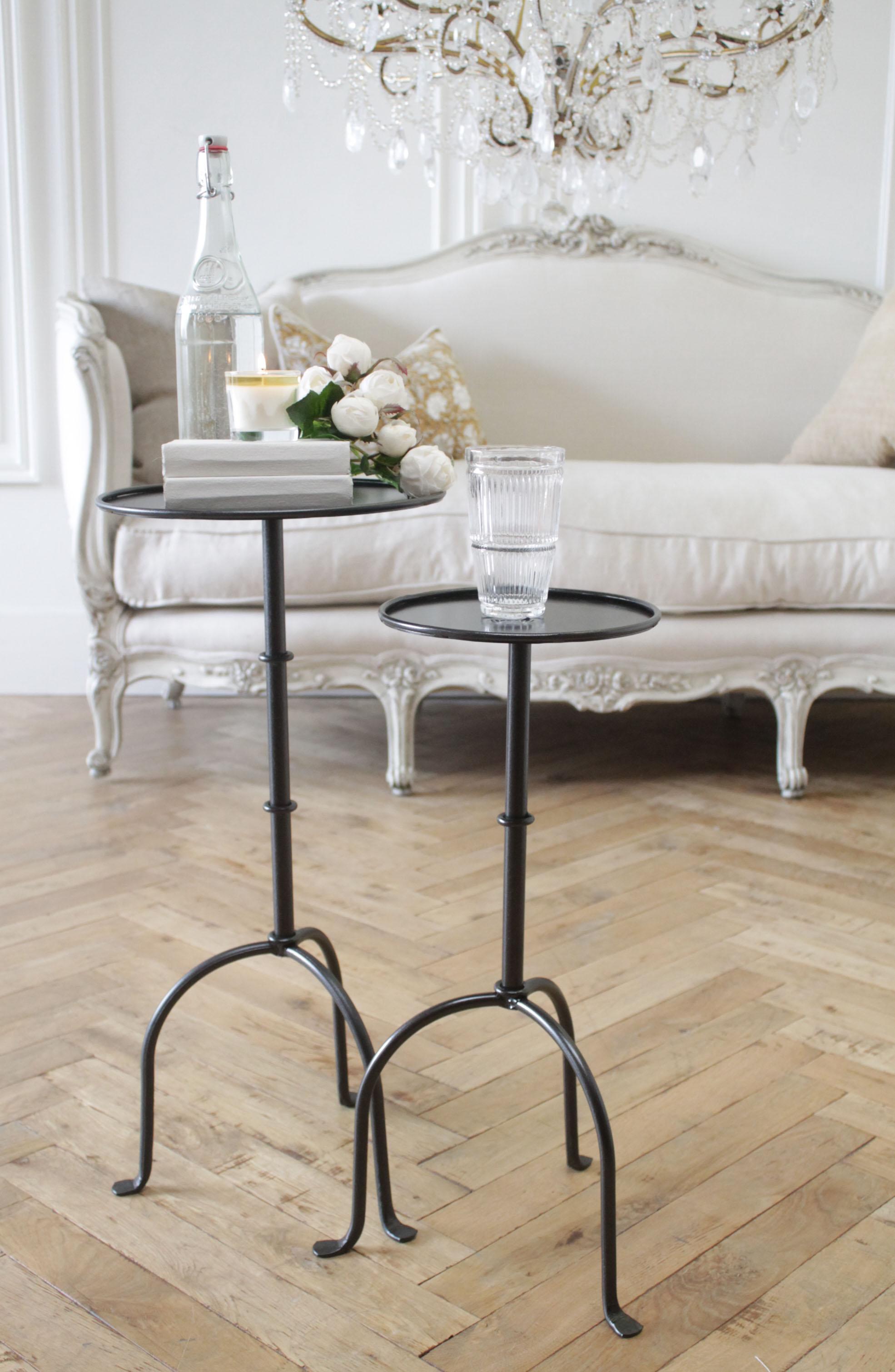 Cannes tall iron drink table in iron finish 
Inspired by the antique version, this tall drink table is forged iron with a round tabletop. Offered in either the dark iron finish, or antique brass colored finish.
Made in the USA, custom designed by