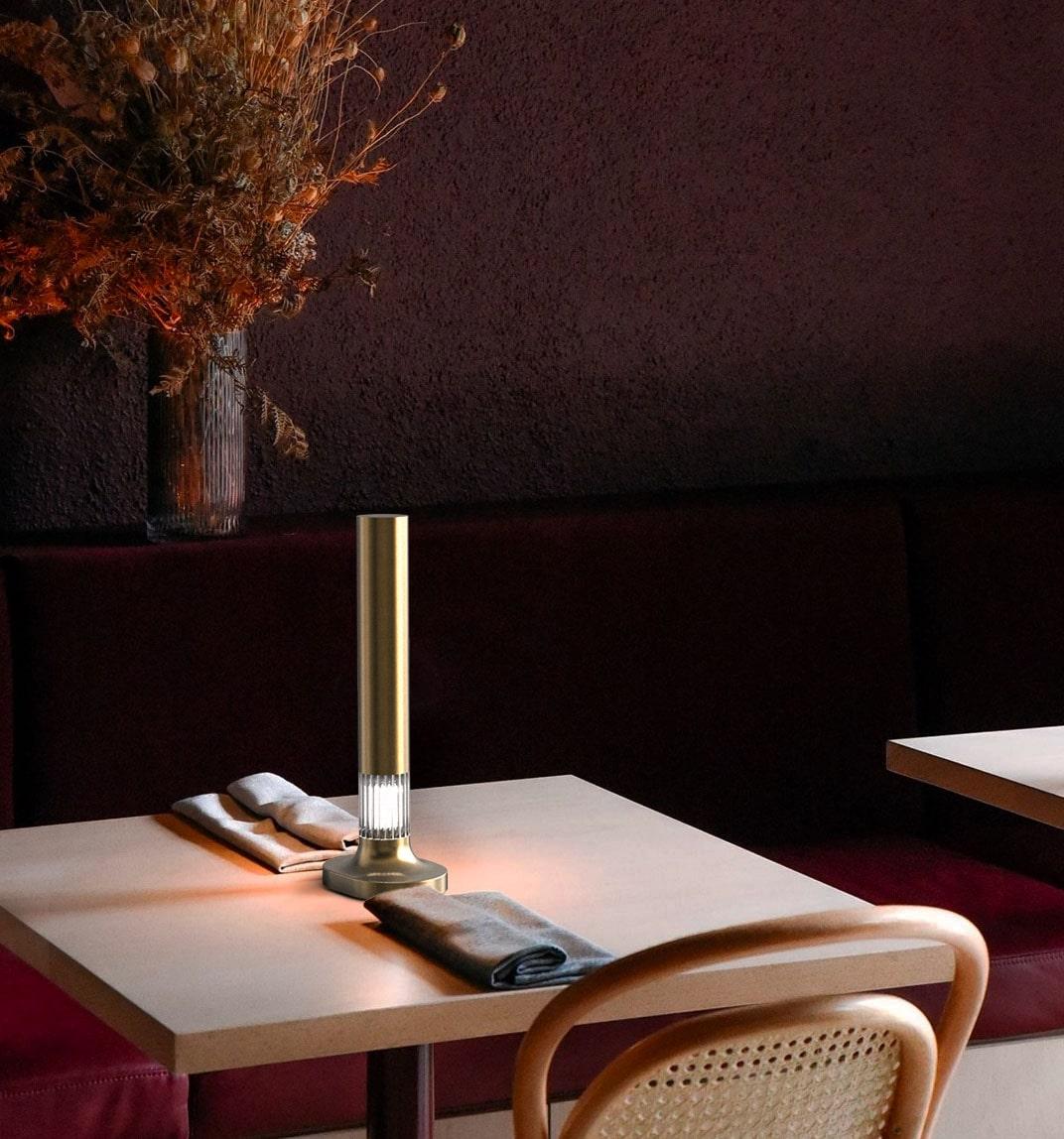 Creating the right atmosphere through lighting is an essential imperative. Bronzetto made it elegant creating this small rechargeable amber brass table wireless lamp. Canneté the new line of rechargeable LED table lamps in brass and ribbed glass.