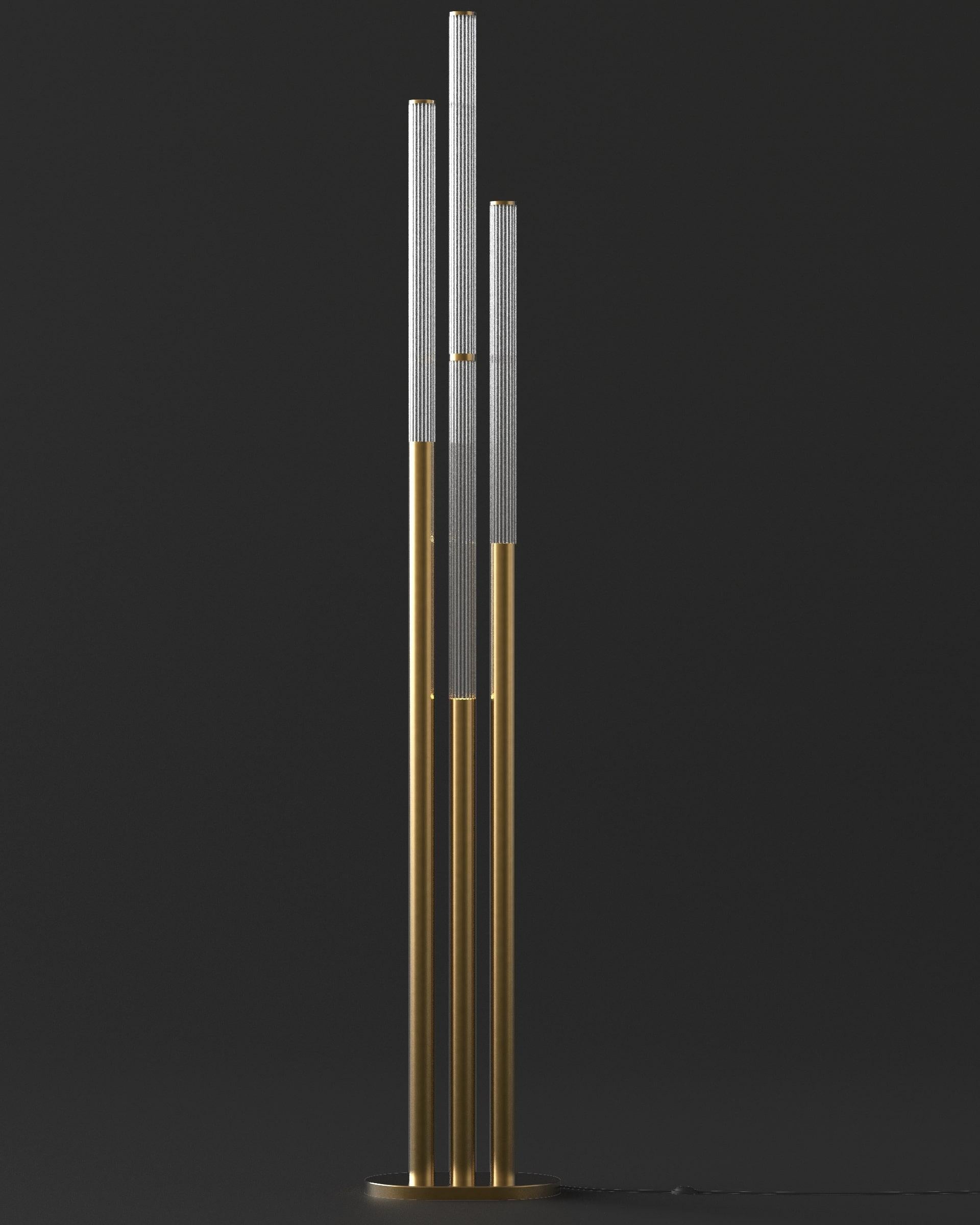 Canneté brass organ pipes floor lamp pertains to the Brass Brothers & Co. collection in which classical objects, lamps and furniture have been reinterpreted in more contemporary shape. This floor lamp model is a perfect mix between classic and