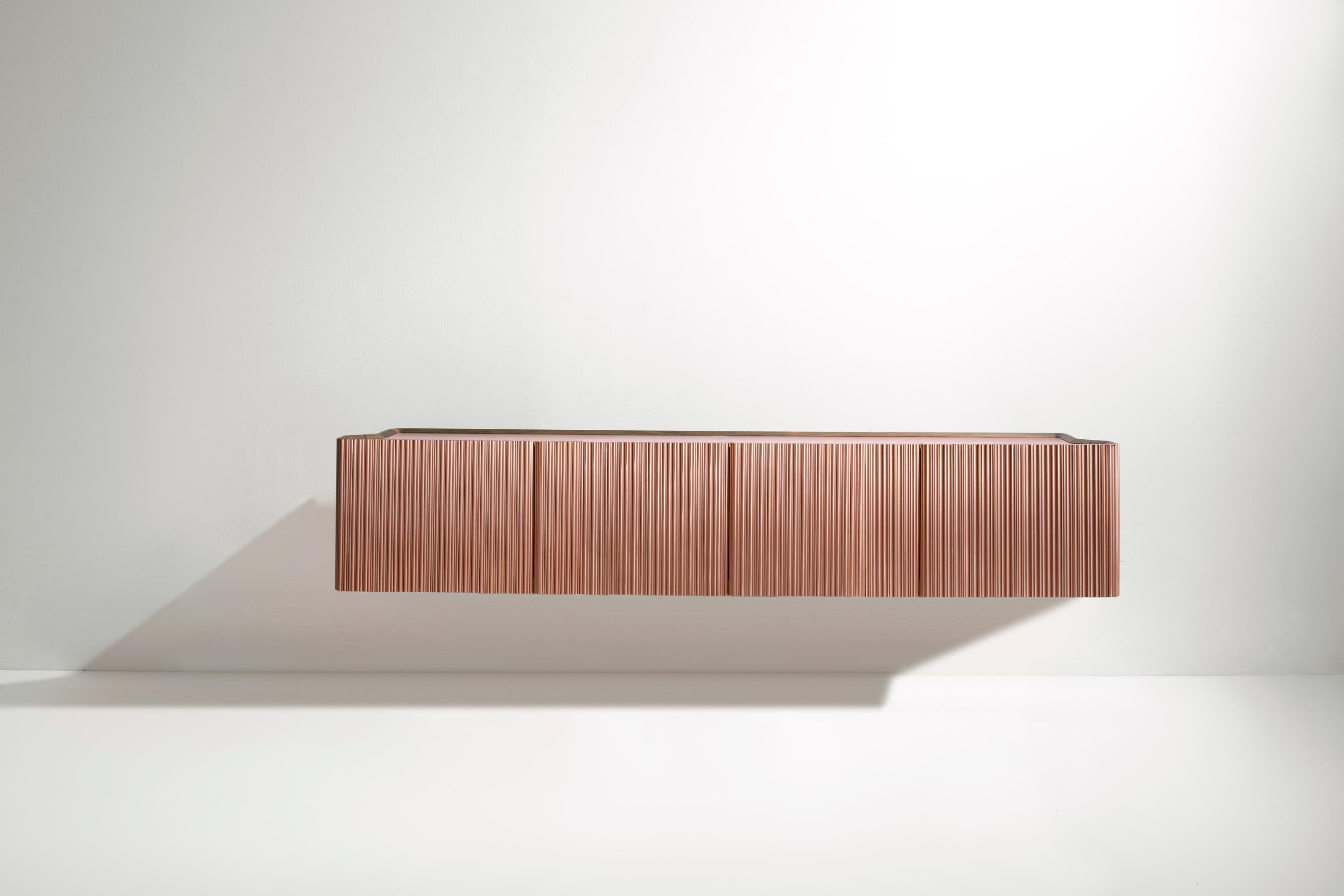 Canneto Wall Mounted Console by De Castelli
Dimensions: W 234 x D 41 x H 45 cm
Materials: Brushed Copper, Canaletto Walnut Wood
Brass and Stainless Steel versions available. Smaller version of the Canneto Console also available. Please contact us