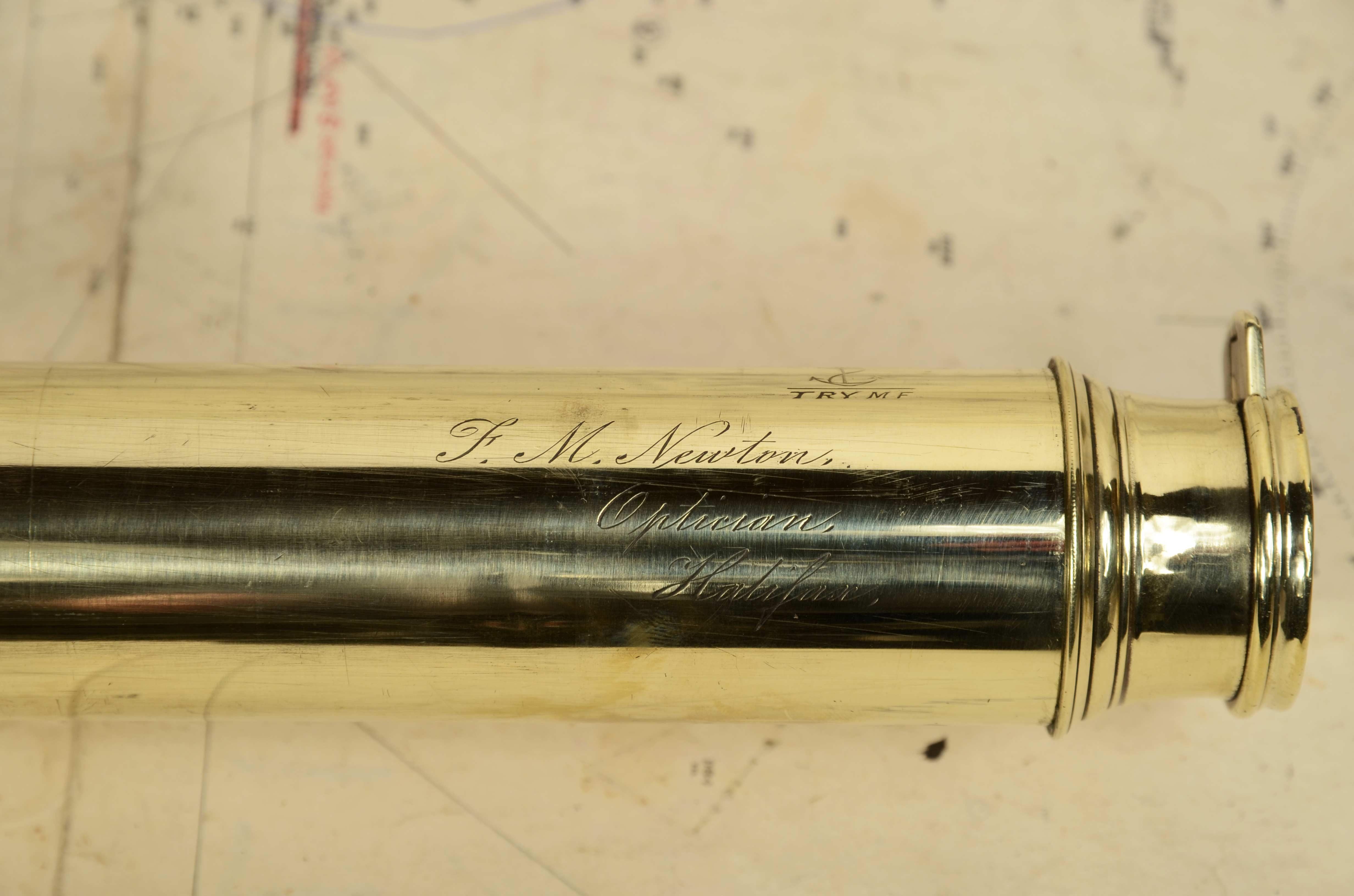 Brass telescope with leather-covered handle and three-extension focus, signed F.M. Newton Optician Halifax of the  second half of the 1800s. Maximum length cm 87.5, inches 34.4 minimum cm 30,- inches 11.7 focal diameter cm 4.5 - inches 1.8. Good