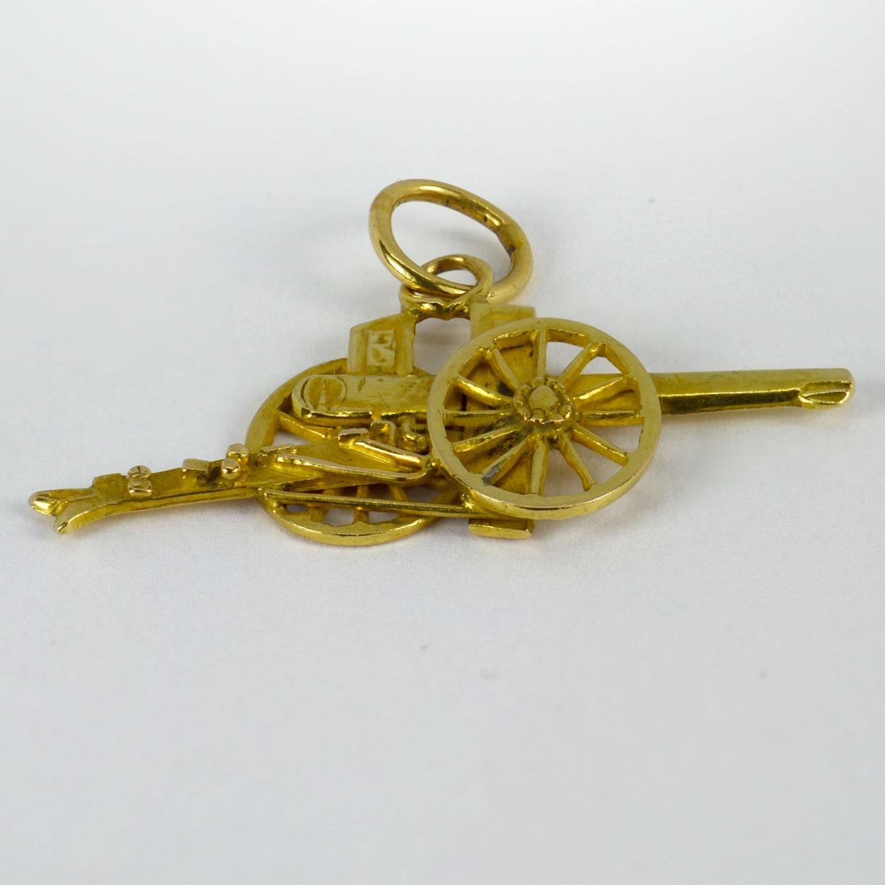 An 18 karat (18K) yellow gold charm pendant designed as a cannon. Stamped with the owl mark for French import and 18 karat gold.

Dimensions: 2.1 x 3.7 x 0.3 cm (not including jump ring)
Weight: 3.82 grams 

