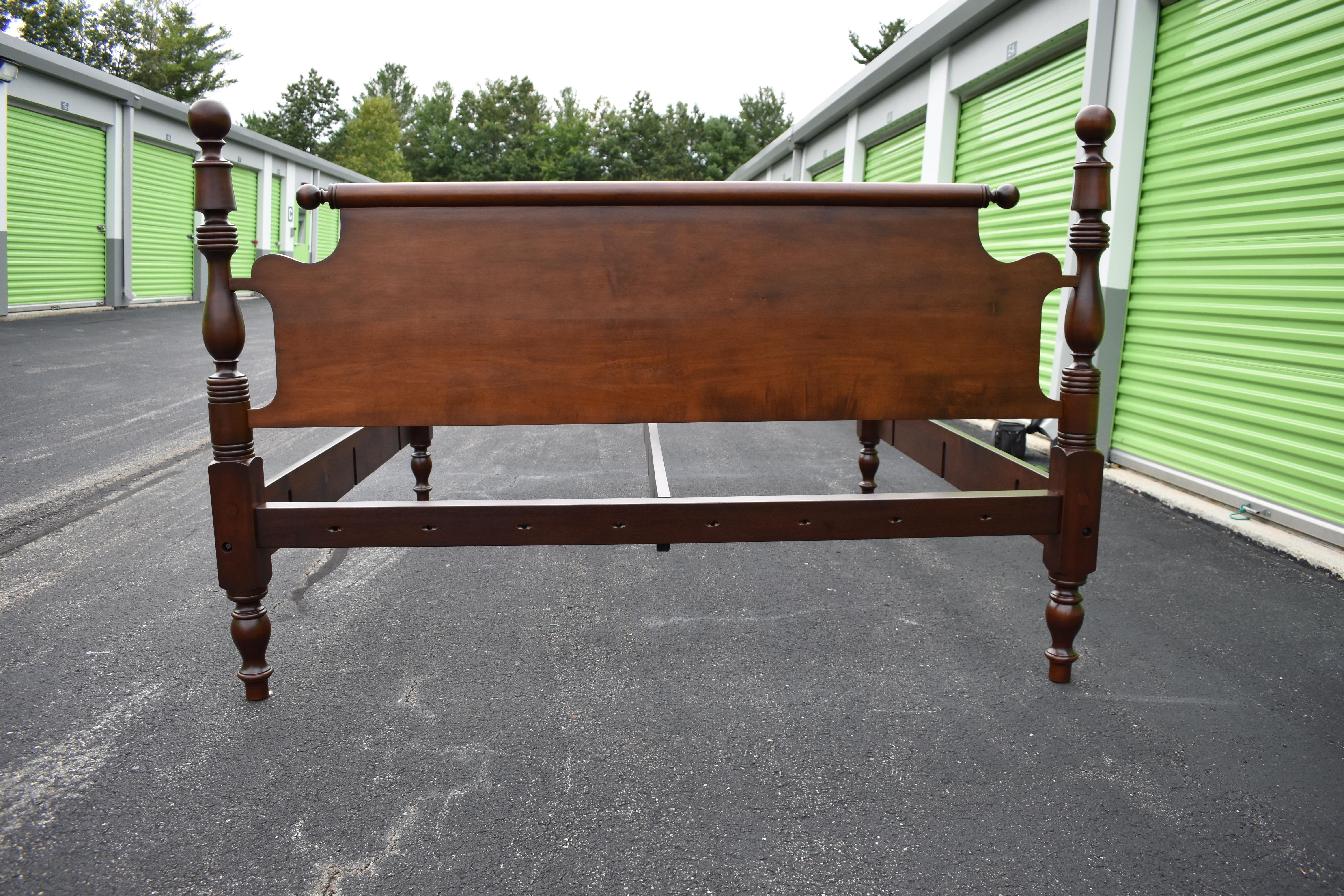 Cannonball and bell lowpost in Cherry circa 1840 refitted to standard king with Blanket rail and roll top repeat end headboard. Completely refinished in antique Cherry. 3