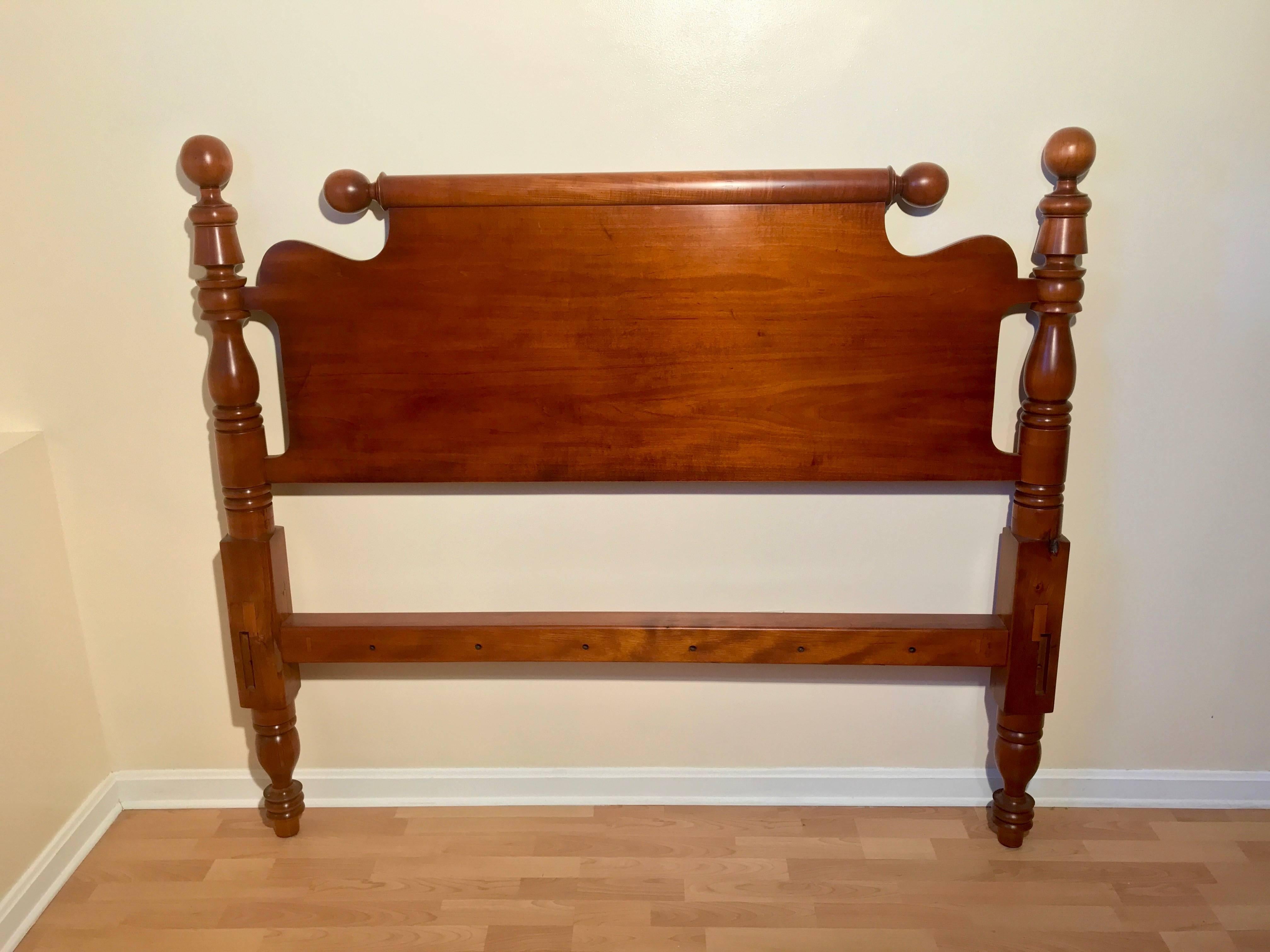 Cannonball and bell lowpost in maple circa 1840 refitted to standard queen with roll top repeat end headboard. Provenance: New Hampshire. Antique 3 x 3 rope hole cross rails, 1 x 7 side rails. Traditional maple finish.

- All beds come with bolts,