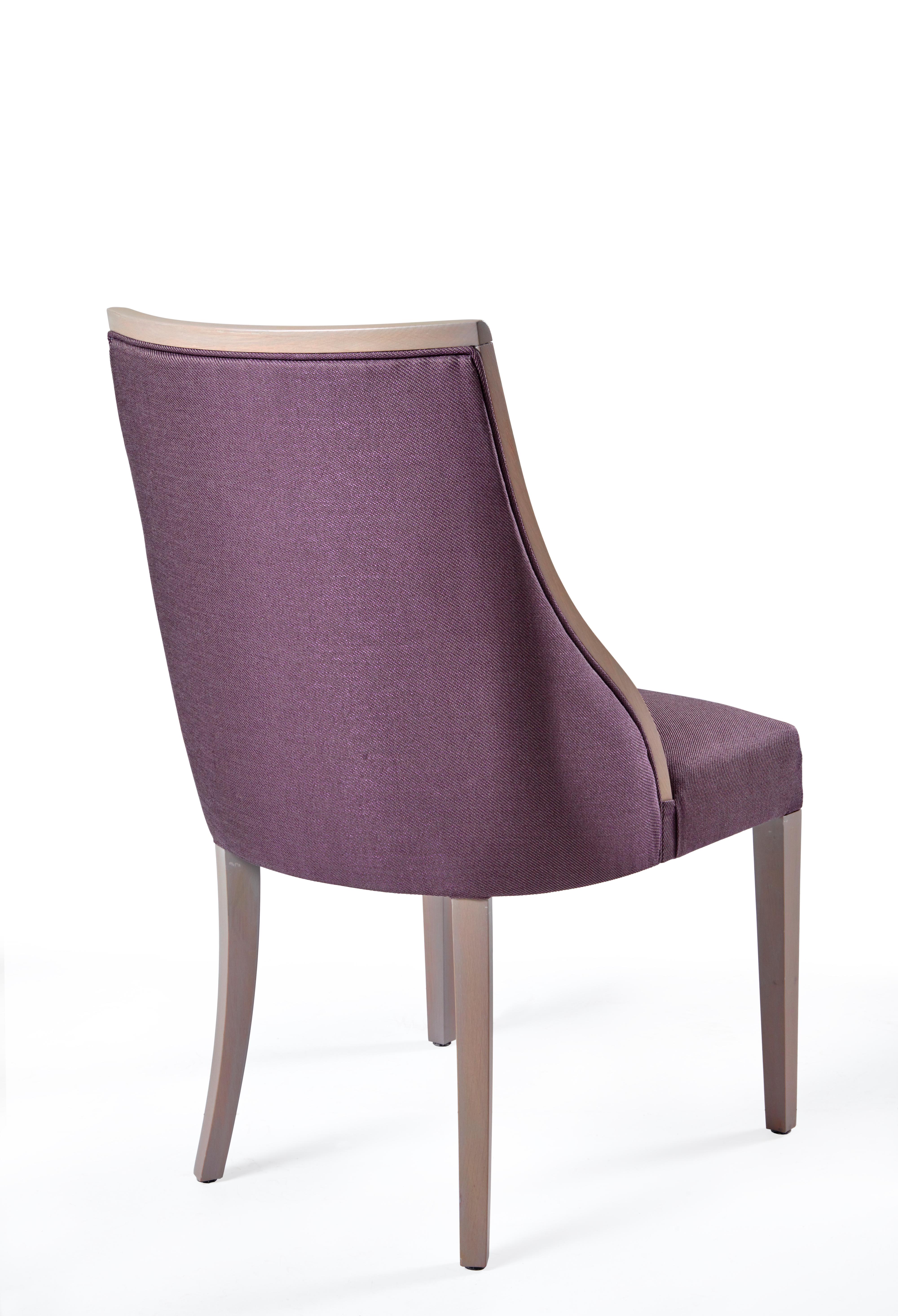 The chair has major curve appeal! A sultry side silhouette, flared back leg and sink-in seat make this the perfect chair for long dinner parties.