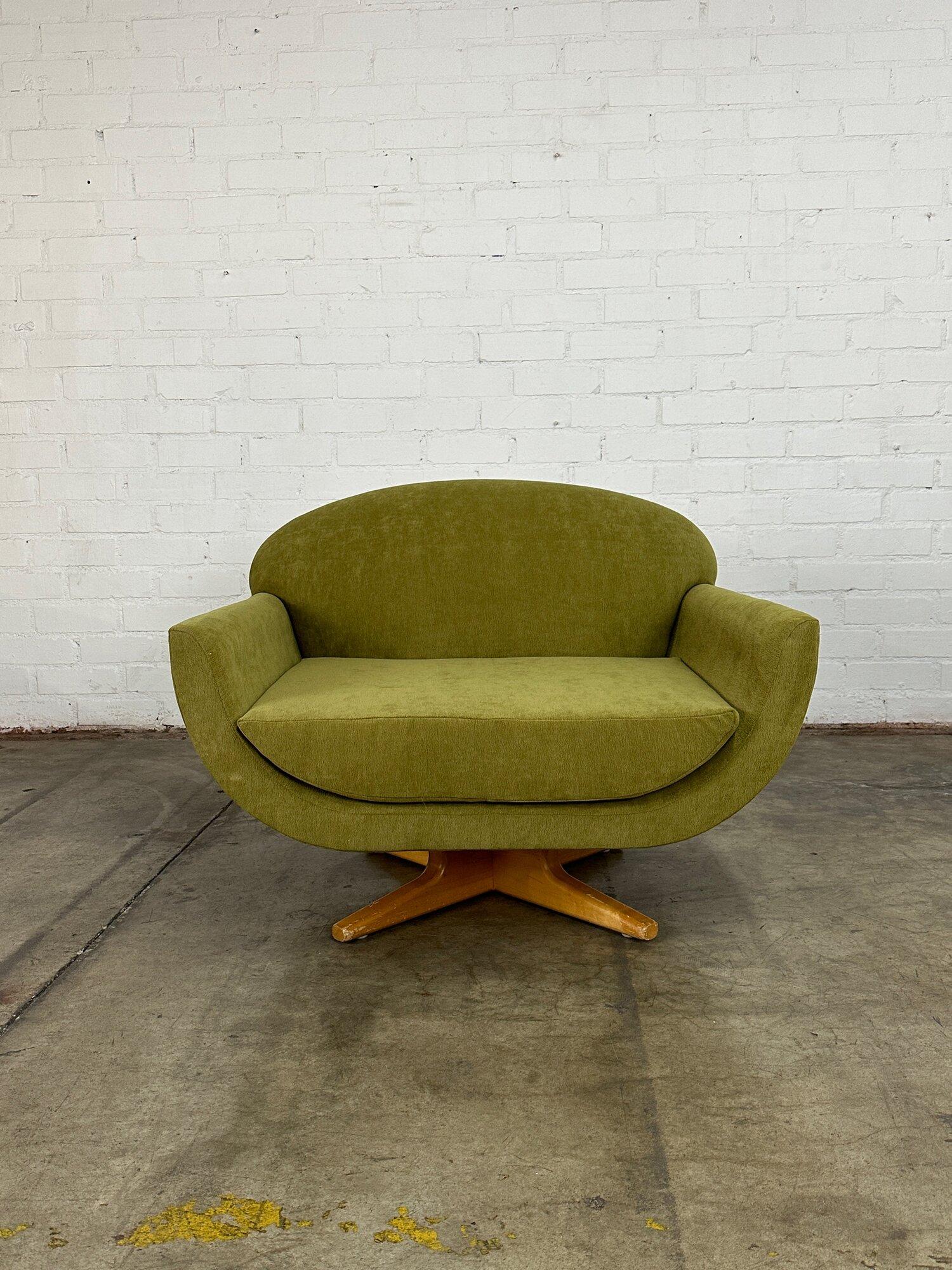 W40 D35 H29.5 SW31.5 SD23 SH17 AH22

Canoe Swivel Chair by In House Furniture newly upholstered in Posion Apple green Chenille. Chair sits on a maple star shaped pedestal. There is some scuffs on the base that have been pictured closely
