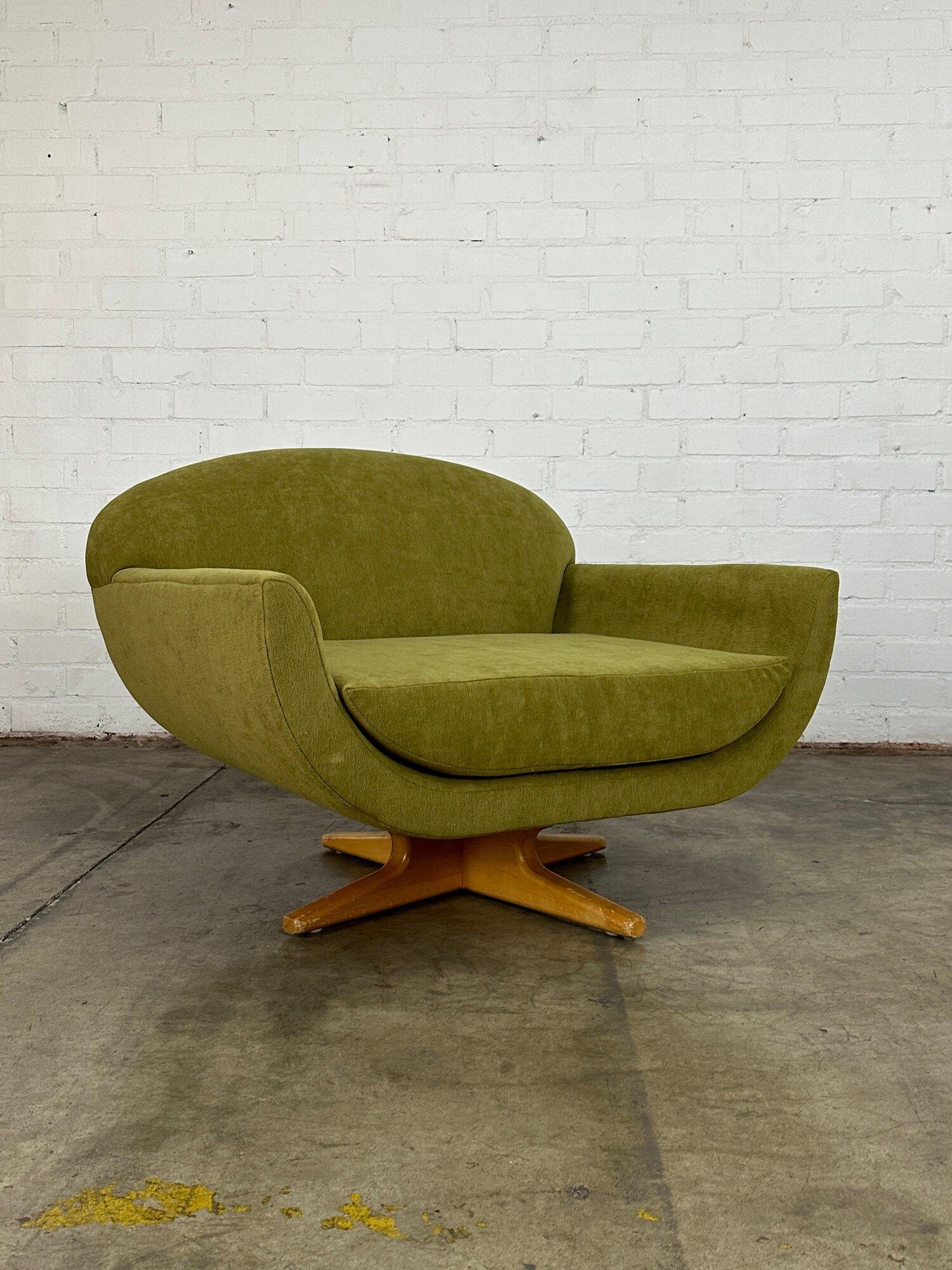 Post-Modern Canoe Swivel Chair by In House Furniture For Sale