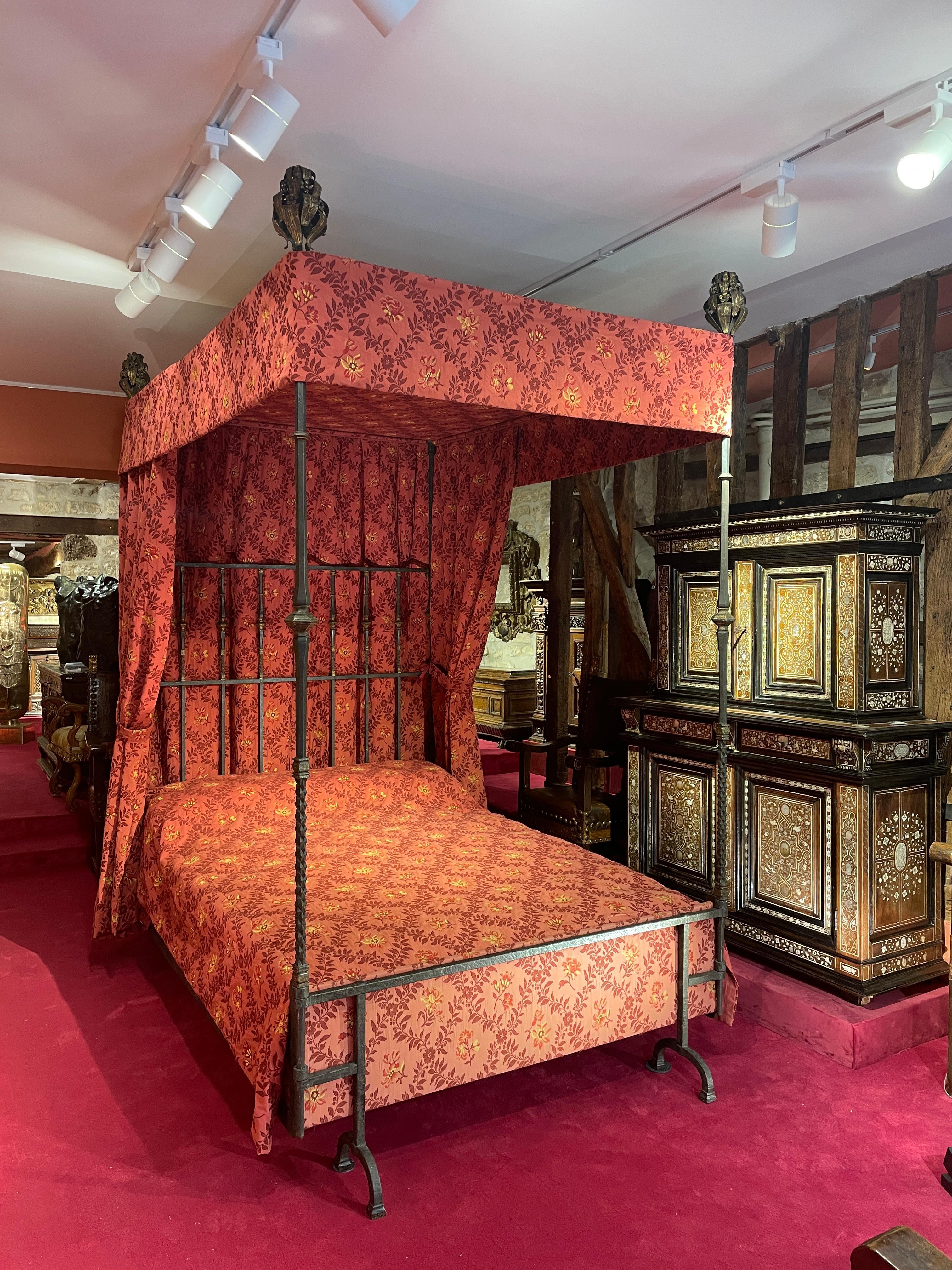 CANOPY BED IN HAMMERED AND GILDED WROUGHT IRON
 
ORIGIN: SPAIN
PERIOD: 16TH CENTURY
 
Height: 270 cm
Length: 152 cm
Depth: 240 cm
 
(Base: H. 206 cm; W. 148 cm)
 
Hammered and gilded wrought iron
Provenance : Galerie Etienne Lévy; Paris, 28 January