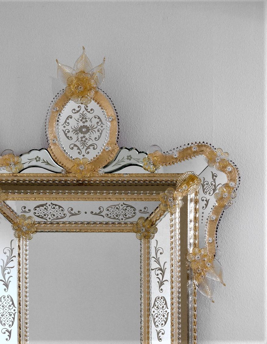 Venetian style mirror made to a design by Fratelli Tosi, in Murano glass, entirely hand made following the techniques of our ancestors. Mirror composed of a central rectangle with crystal and gold frame in Murano glass and decorated with curls in