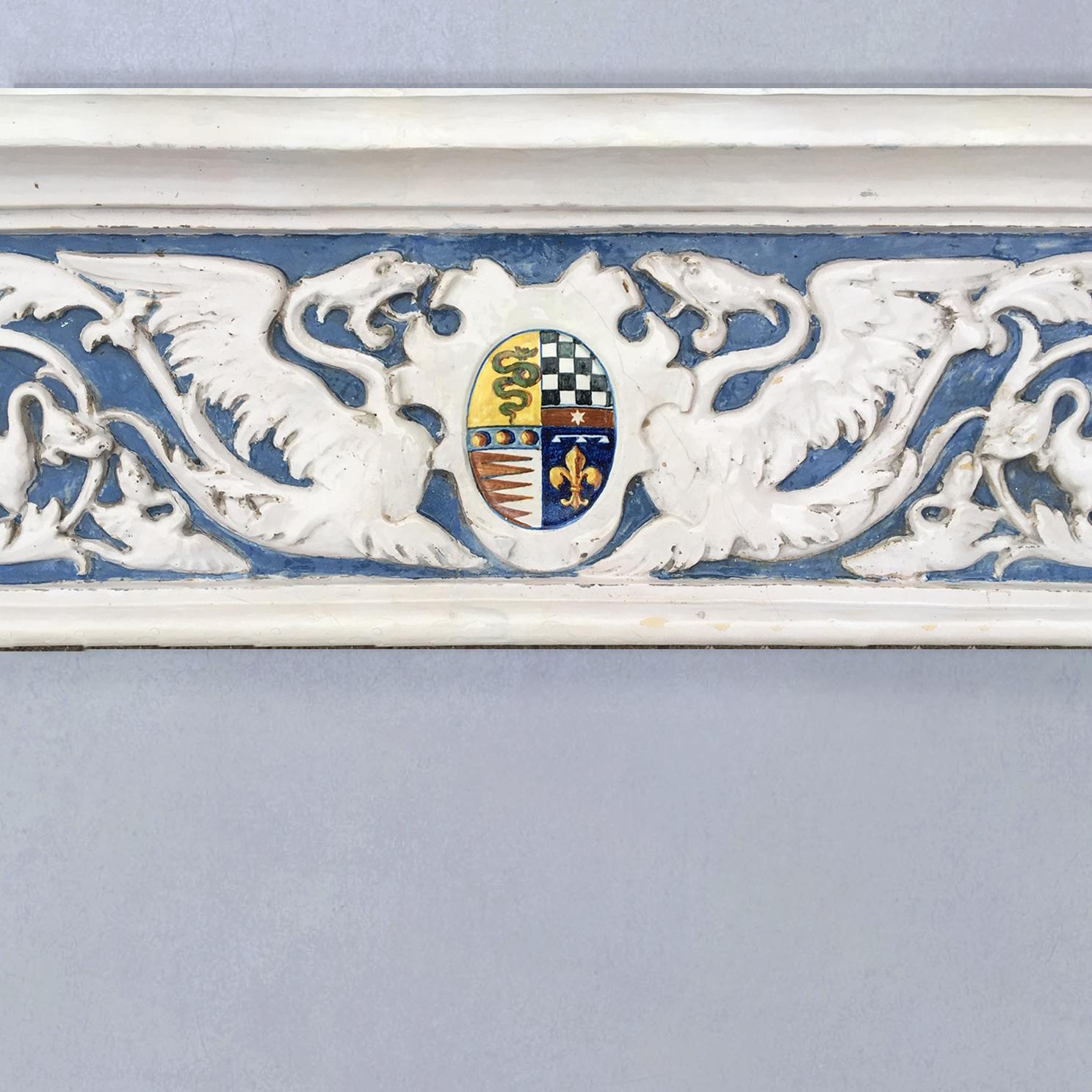 This exceptional and rare Della Robbia style fireplace was made in the 19th century by Ulisse Cantagalli, Italian leading designer of pottery and lustre ware. As far as known, there are only 3 of these fireplace in existence; one at Cantagalli’s