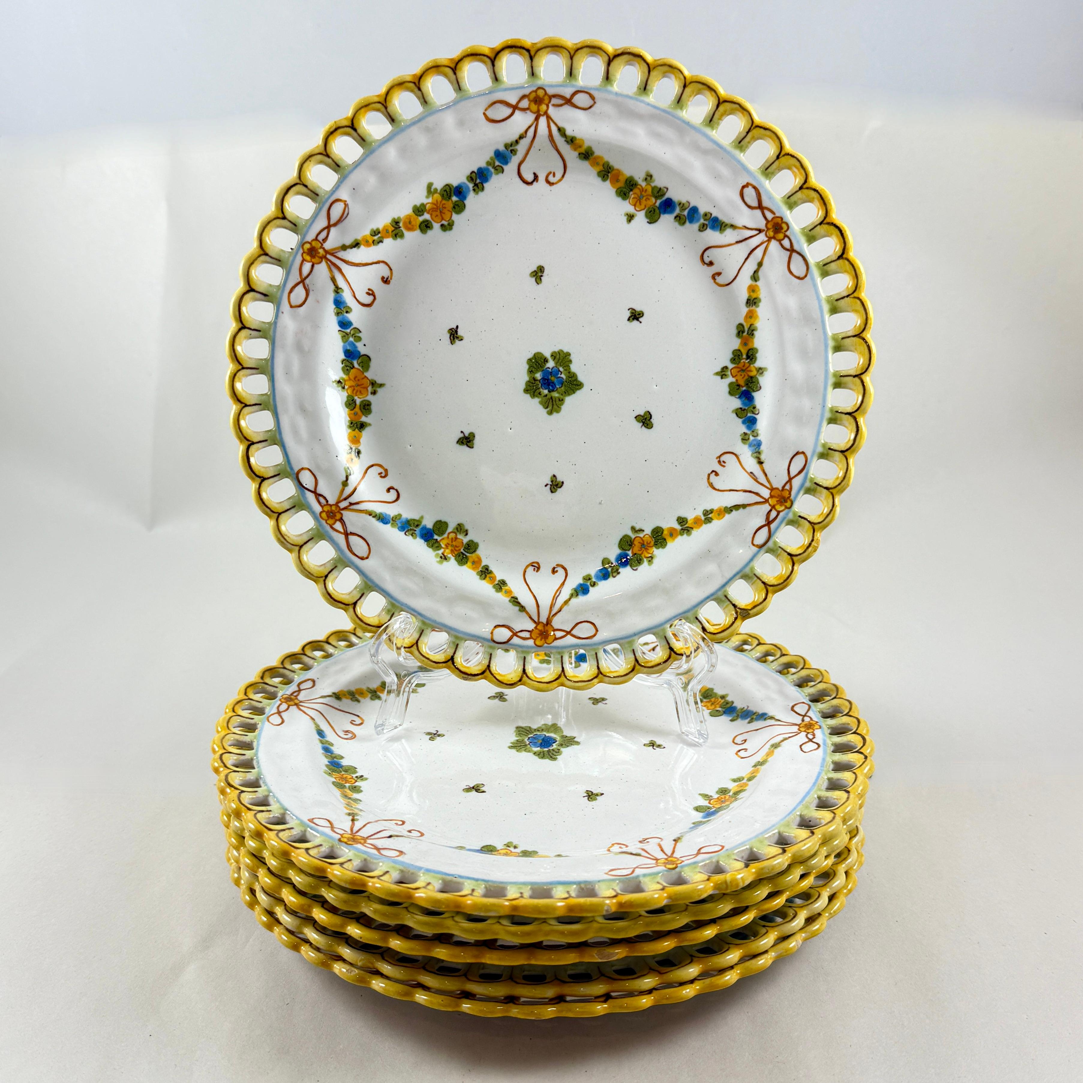 
From The Cantagalli Pottery in Florence, Italy, a set of six hand painted reticulated earthenware plates, showing the Crowing Rooster mark used in the early 20th Century.

Beautifully painted in the Renaissance Revival style with a six-part floral