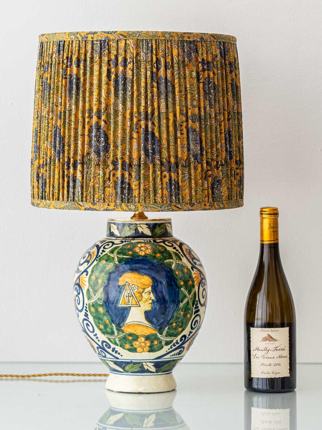 Exquisitely handcrafted by Amitābha Studio in Amsterdam from a 19th-century Italian Renaissance Revival vase (circa 1880–1900), Cosimo is a one-of-a-kind table lamp. The base—a richly detailed ceramic vessel inspired by the maiolica tradition of