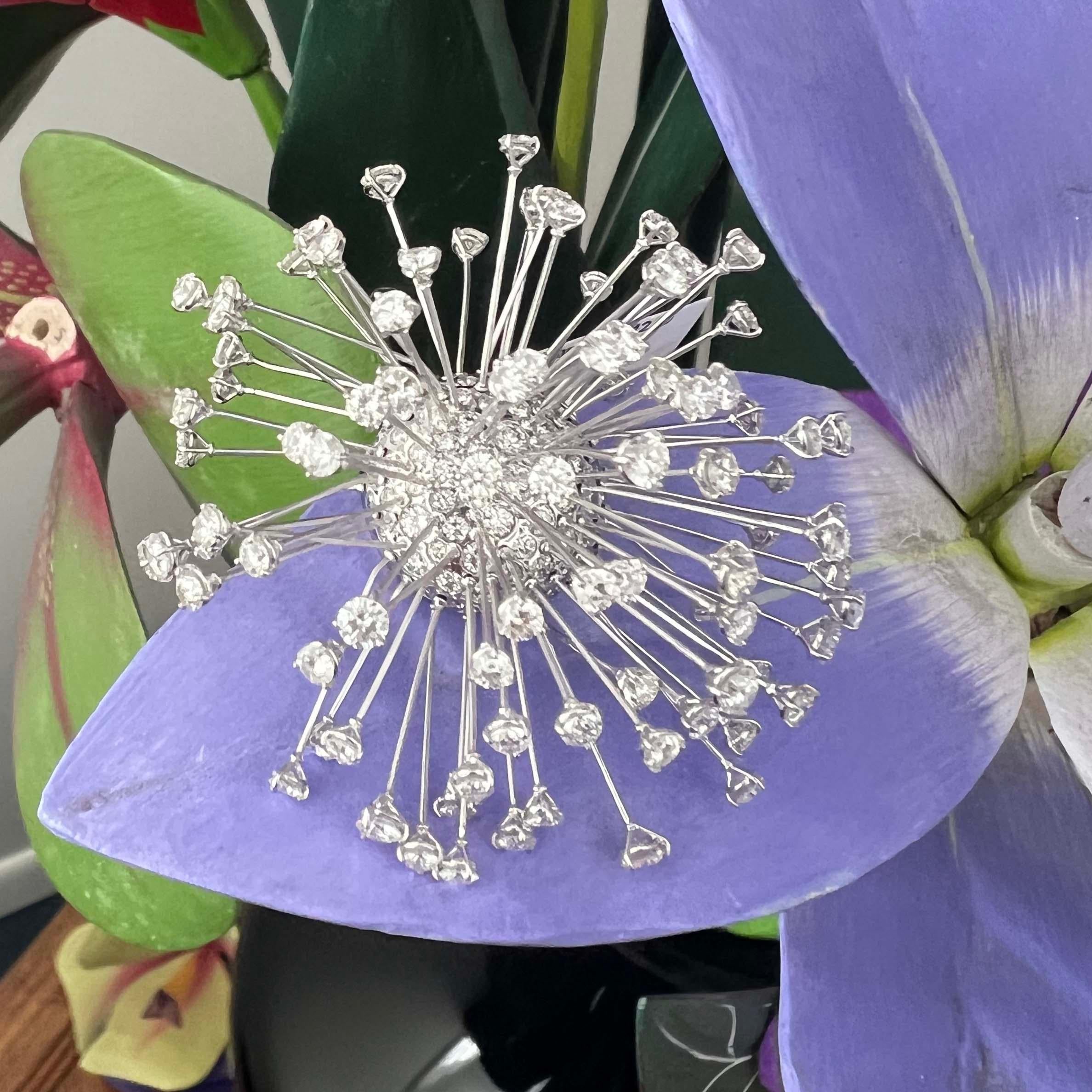 Circa 2000s, 18 karat white gold, diamond firework brooch, by Cantamessa, Italy. 171 stones, 12.00 carats of round brilliant white diamonds, G color, VS clarity. The diamonds are set atop delicate stems of various lengths creating an 
