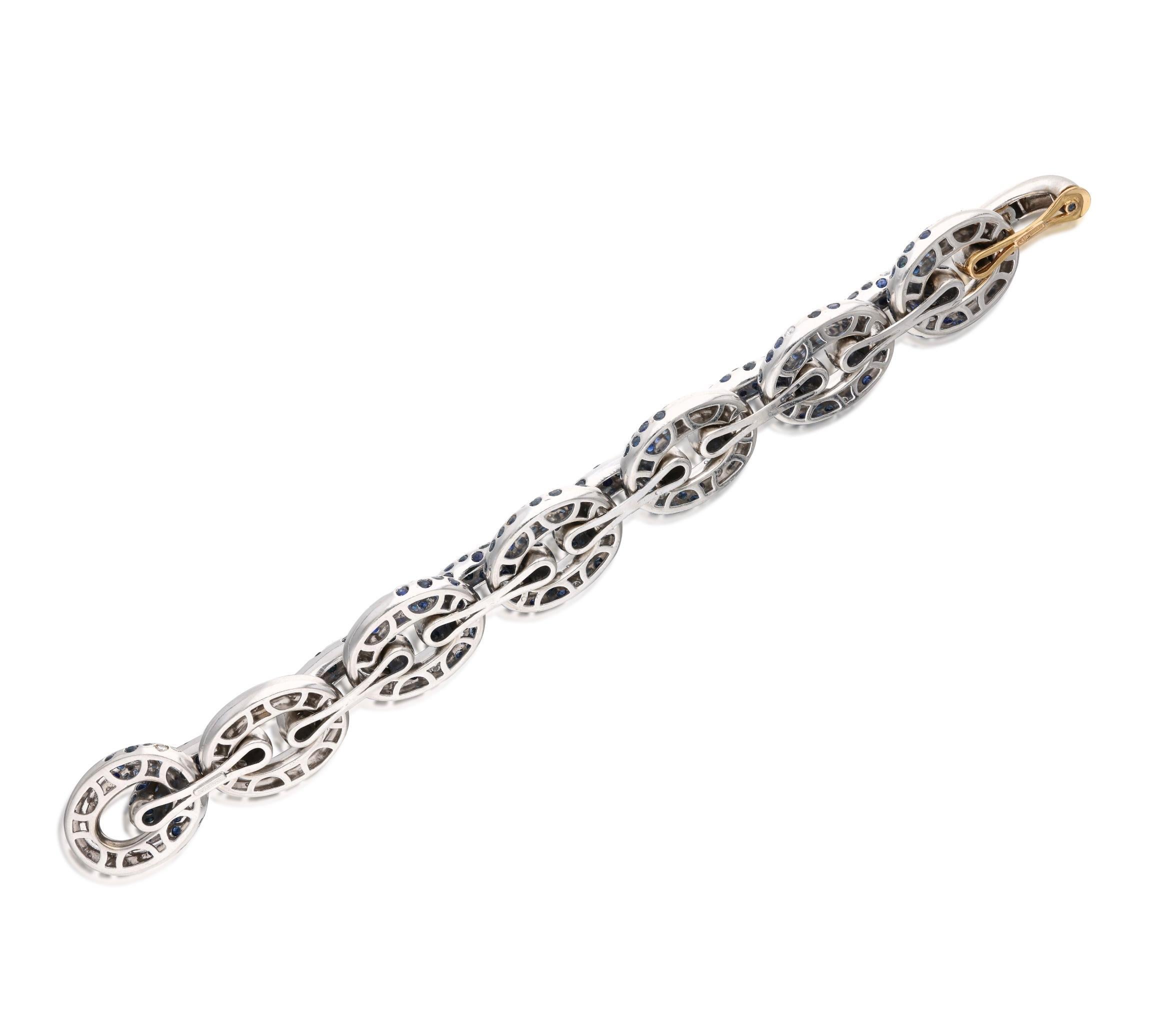 Cantamessa 18 karat white gold oval link bracelet, accented by round-cut diamonds and sapphires. The diamonds weigh a total of approximately 2.30 carats, and the sapphires weigh a total of approximately 10 carats. Marked: Cantamessa. Made in Italy.