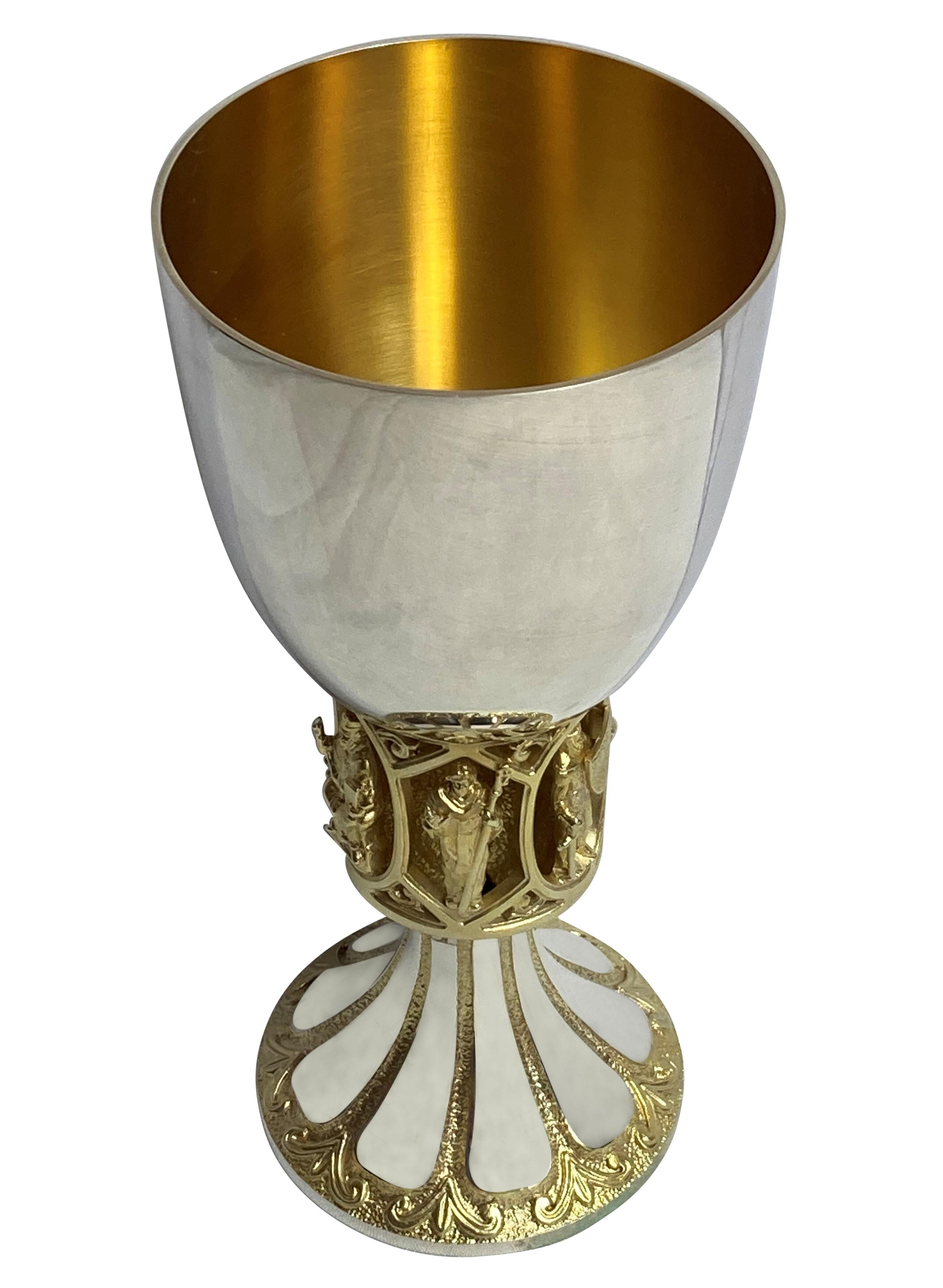 An English Elizabeth II first edition silver and silver gilt chalice, by Hector Miller. There were 500 made and this is 1/500, which belonged to the Dean of Canterbury who commissioned them. Finely executed depicting Canterbury Saints, The Black