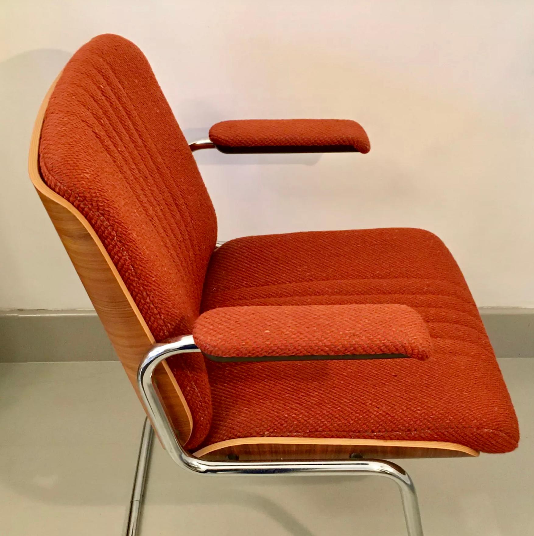 Very comfortable armchair by Martin Stoll for Giroflex dating back to the 1970s. The back shel and seat are in plywood with beautiful curves, the cushions are in a warm brick colour and still in very good condition. The frame is in tubular chromed