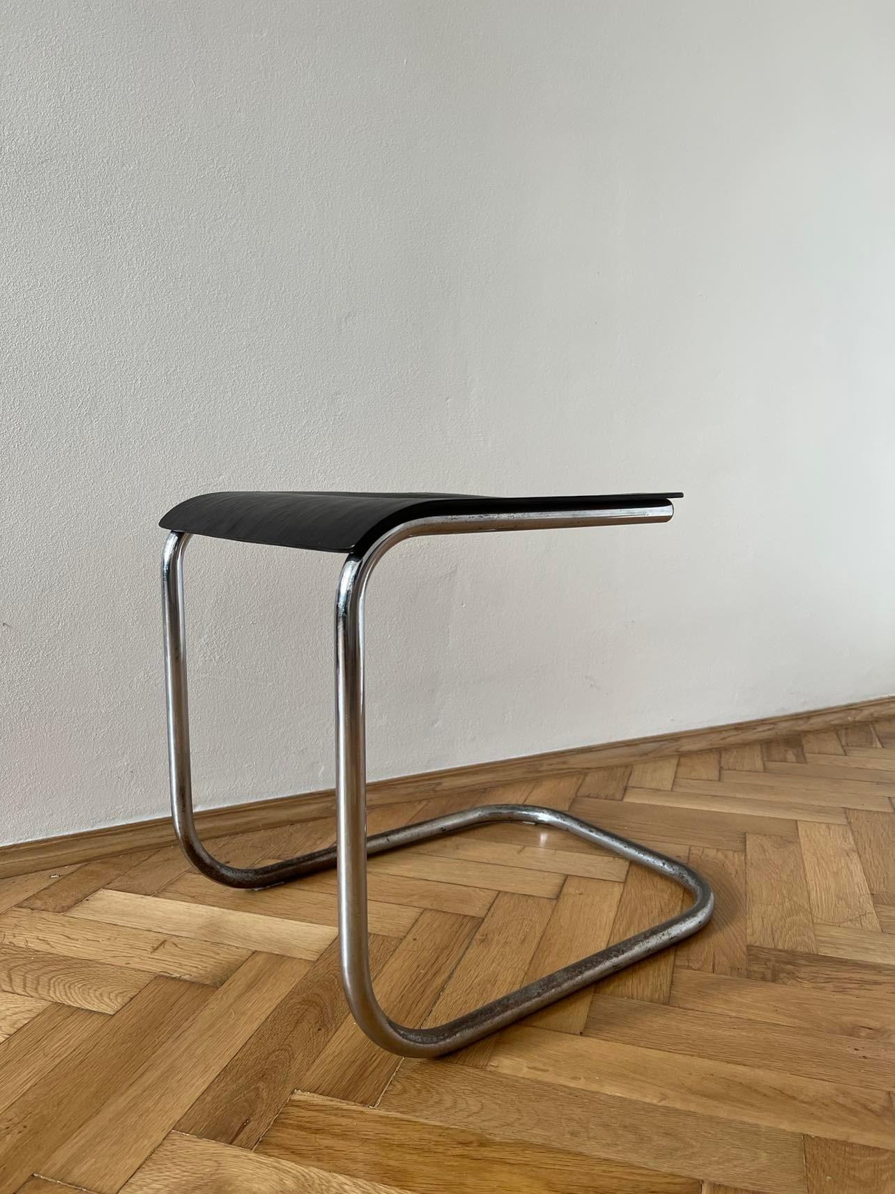 Bauhaus cantilever chrome-plated tubular steel stool designed by Mart Stam for Kovona in Czechoslovakia, 1930s.

This rare Bauhaus stool from the 1930s features a plywood seat mounted on a chrome-plated tubular steel frame, which features a