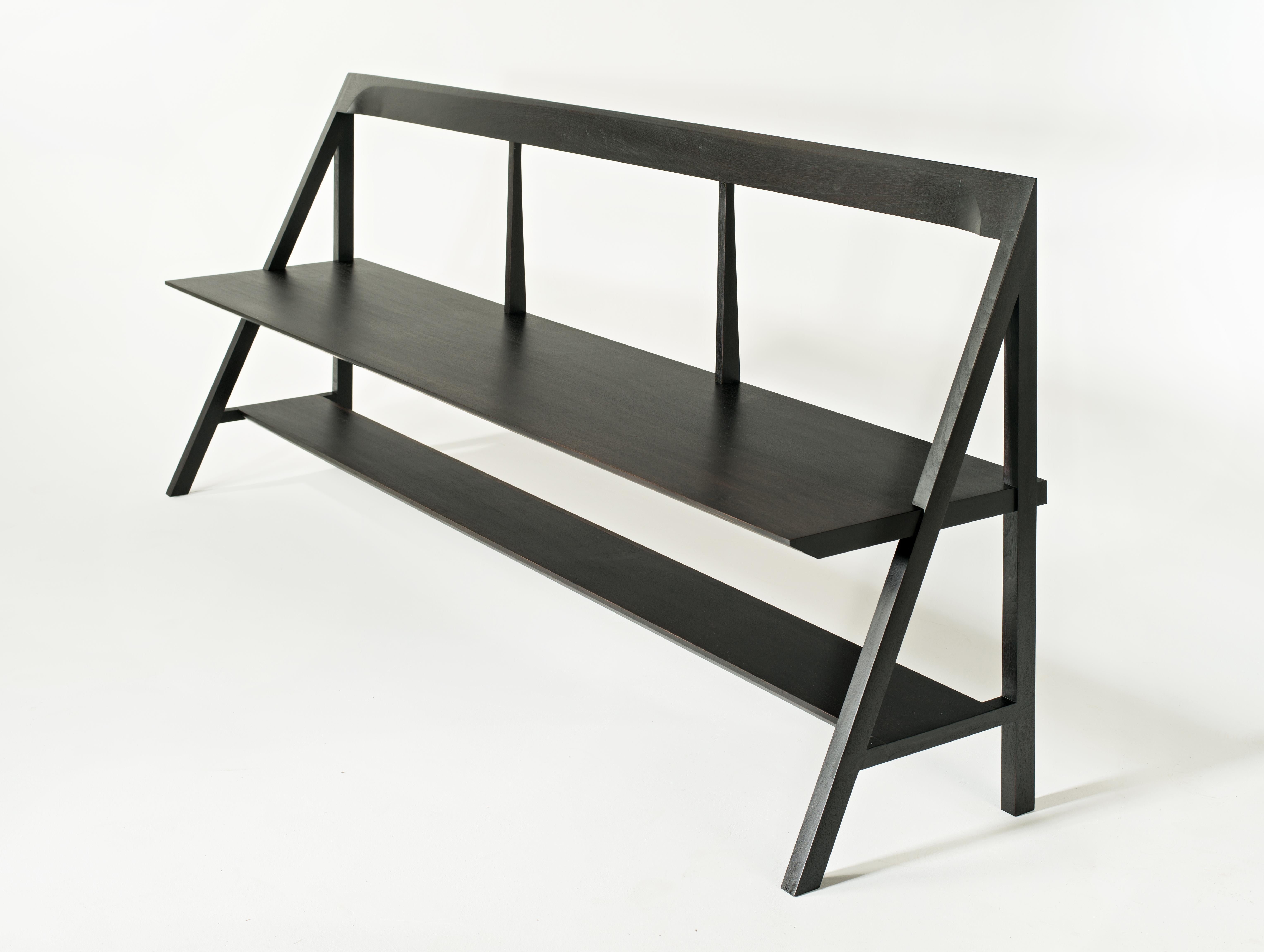 The Cantilever Bench is a simplified form that blends rationality with functionality.
Originally envisioned as an entryway piece, the shelf below provides a practical means of storage without encumbering the overall balance of the piece.