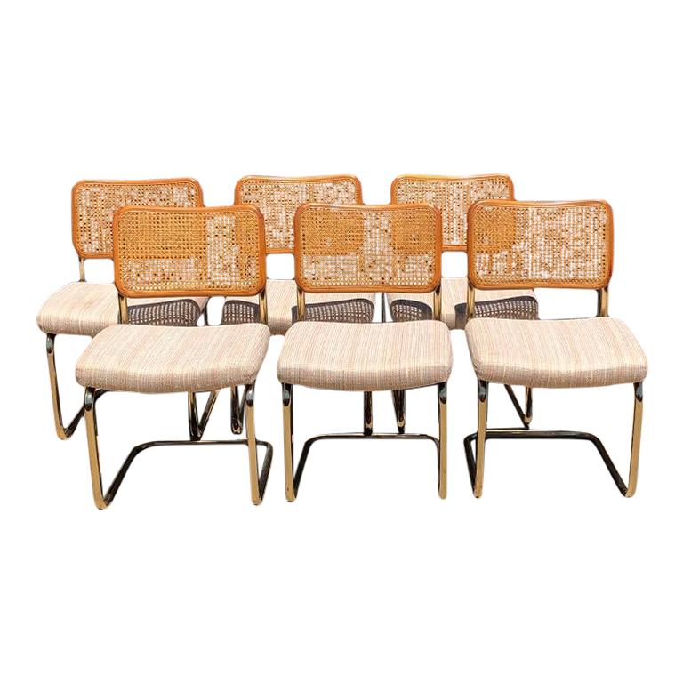 Beautiful set of cantilever Cane Marcel Breuer Bauhaus style tubular dining chairs with upholstered seats. A set of 6.

These cantilever chairs are a beautiful way to add a bit of Bauhaus, Hollywood Regency or Mid-Century Modern to a dining room.
