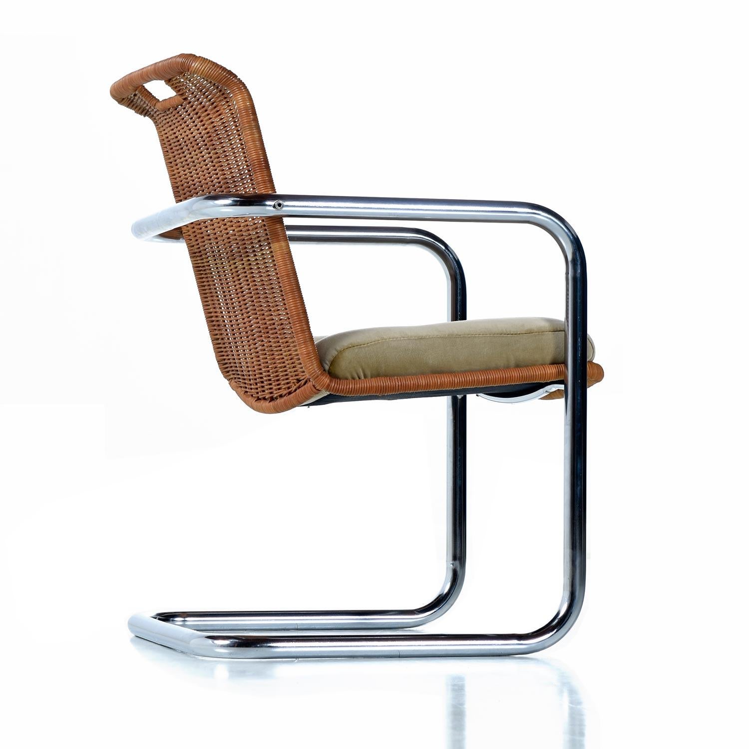 Made by Chromecraft, circa 1970s. The tubular bent chrome is the perfect complement to the tan wicker and gold velvet. These cantilever style armchairs have far more style and detail than can be appreciated in these photos. 

The restoration: Each