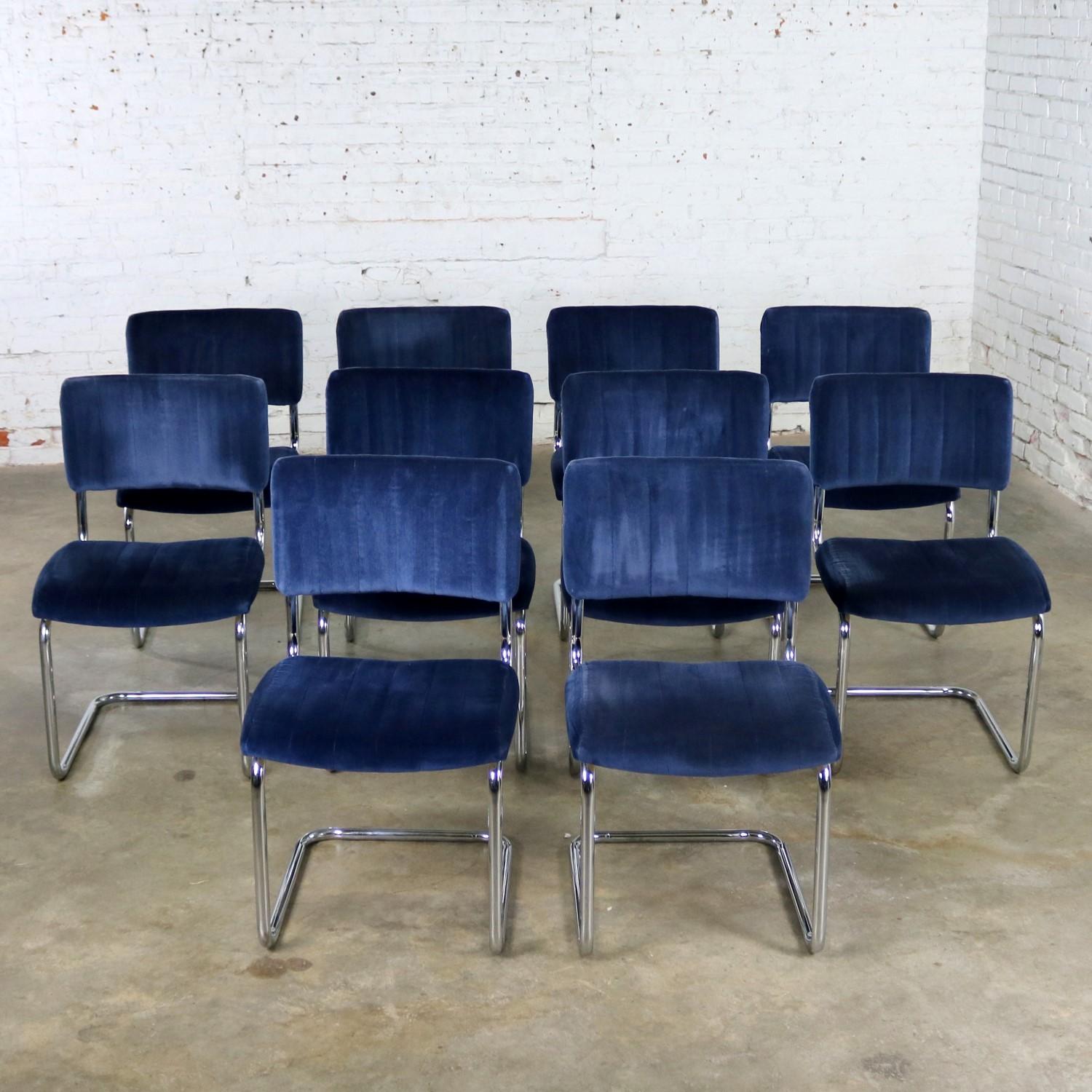 Wonderful cantilevered chrome and light blue velvet dining chairs after the Cesca chair designed by Marcel Breuer in 1928. These chairs are made by Segars Tubular Products and all of the chairs are in wonderful vintage condition with normal wear for
