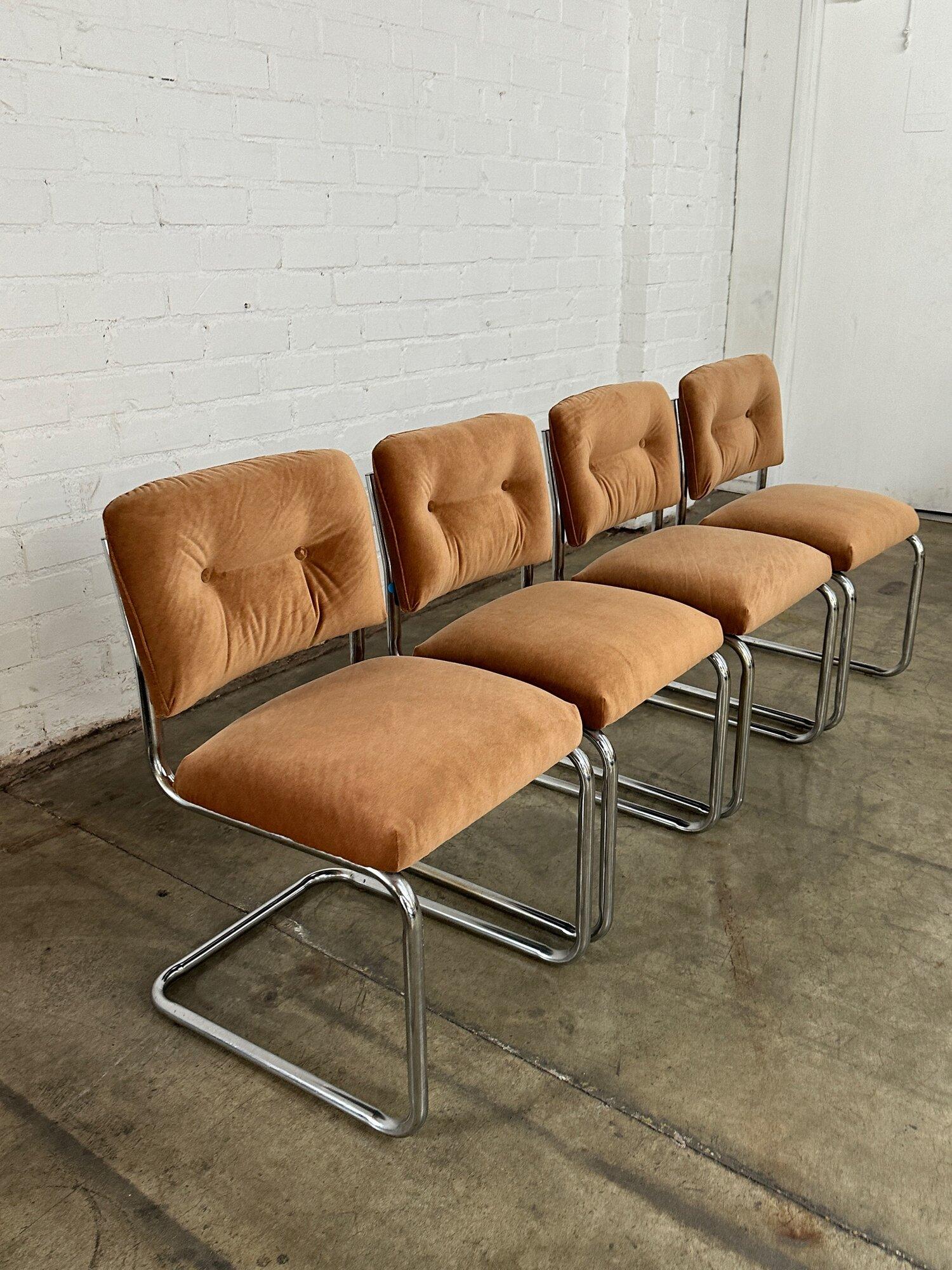 W18.5 D21 H32 SW17 SD15.5 SH18.5

Vintage chrome and velvet dining chairs. Chairs feature a great cantilever design adn show well with no major areas of wear. Chrome has been cleaned and polished. Mathcing dining table is available seprately see