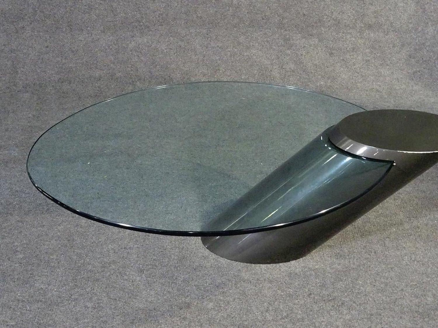 Oval glass set into a lacquered angled base. Designed by J. Wade Beam for Brueton.
(Please confirm item location - NY or NJ - with dealer).
  