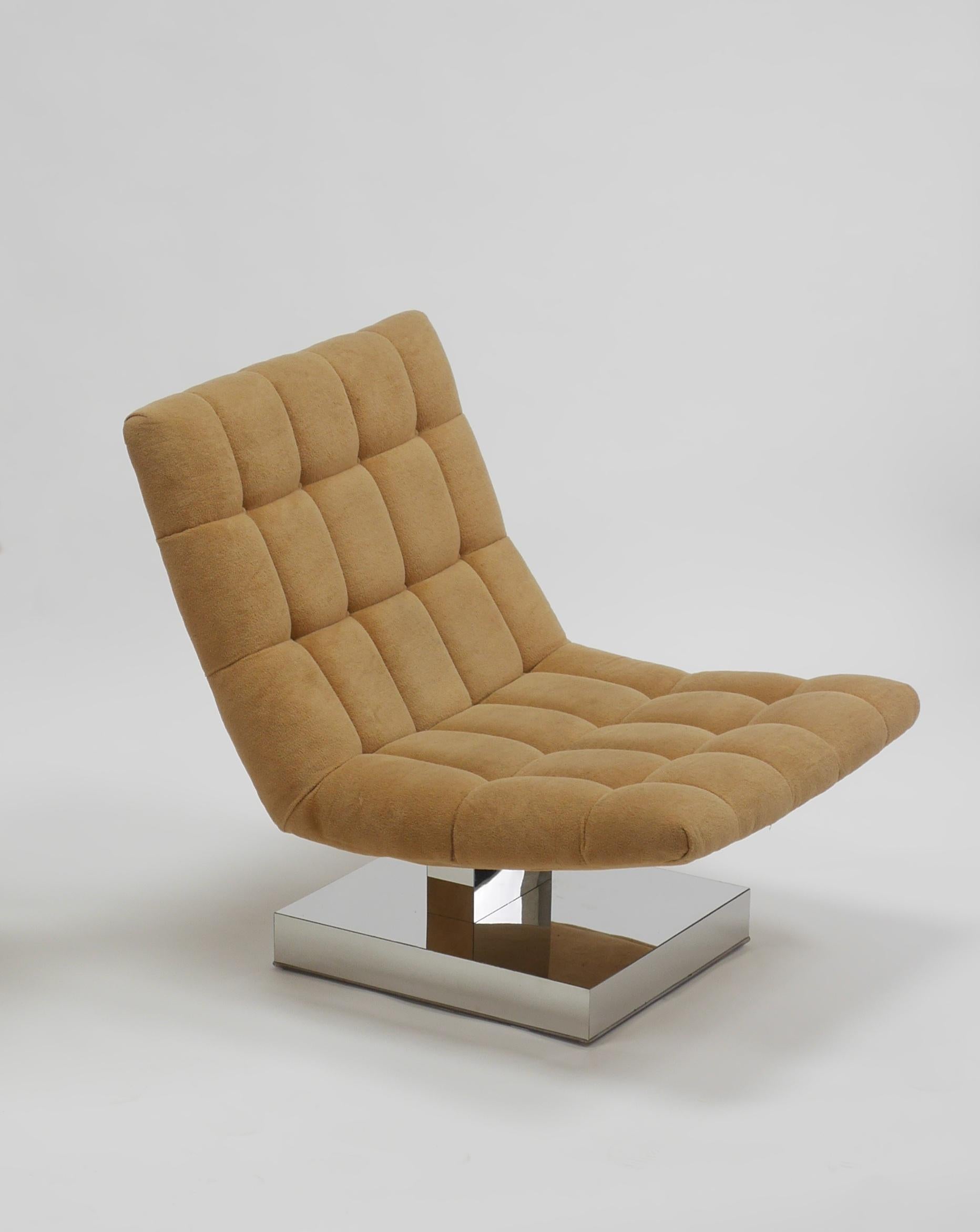 Cantilevered lounge chair by Milo Baughman. Having high polished stainless bases. Large, well made and very comfortable.