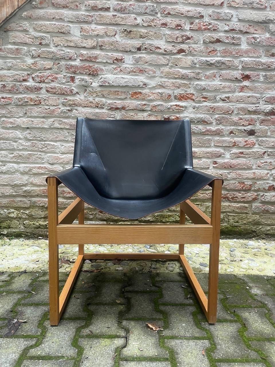 Rare chair with massive beech wood base and thick leather seat. Designed by Rainer Schell in the 1970s. Made in Germany by Schlapp Möbel. 