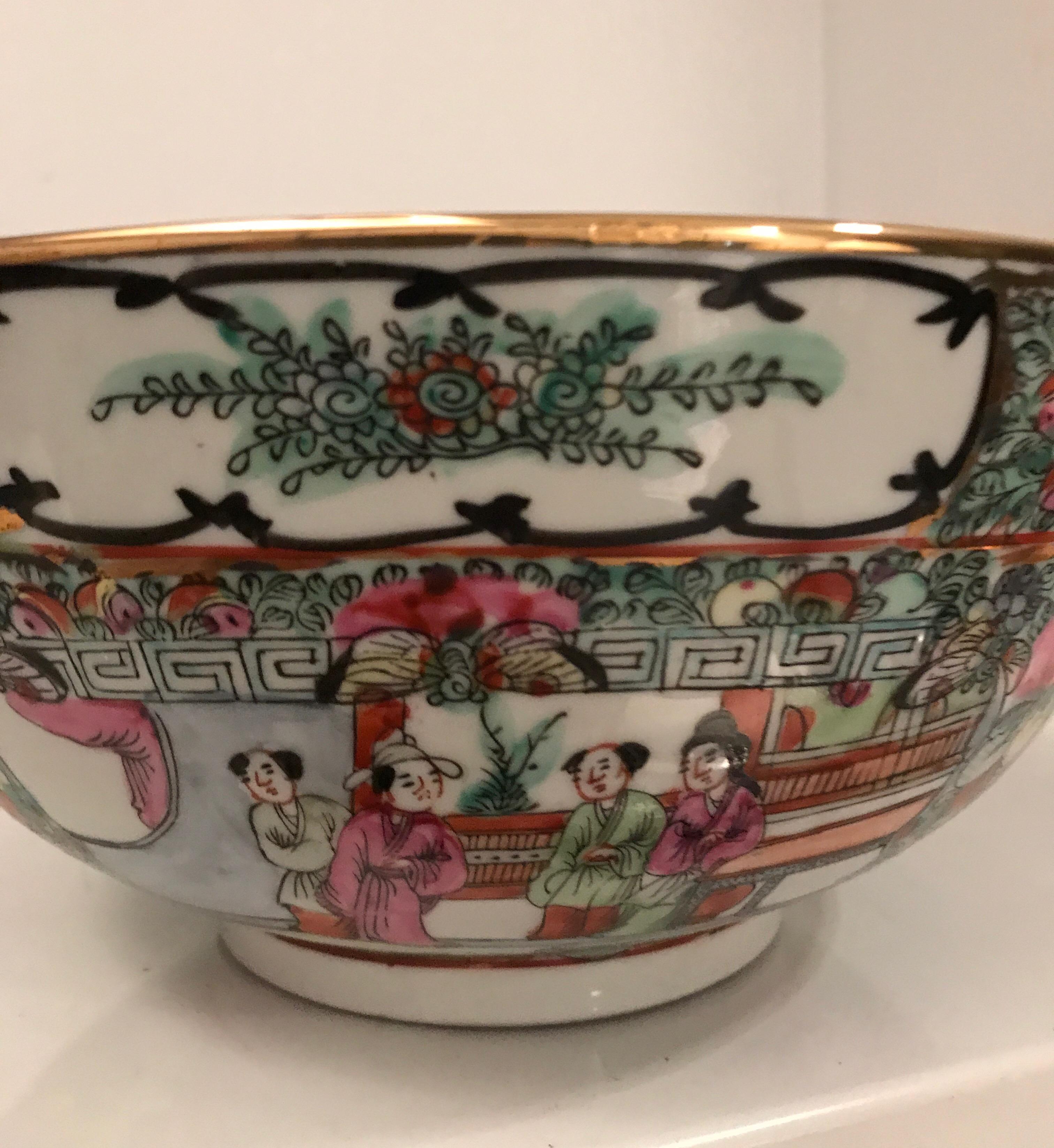 Finely decorated Cantonese enameled famille verte porcelain bowl.
The interior and exterior of the bowl are richly decorated with court scenes
and alternating panels of flowers and foliage.