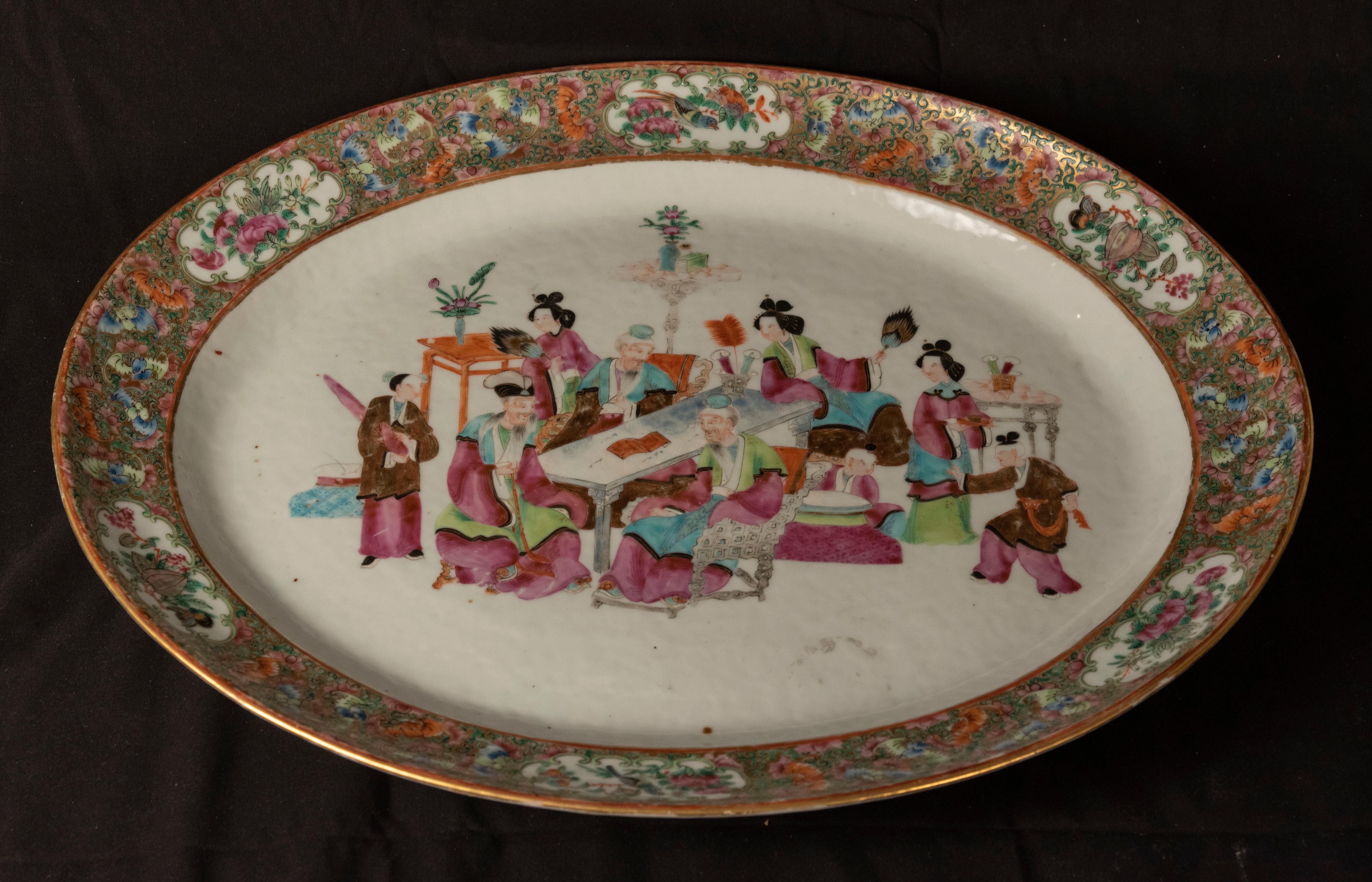 Cantonese Famille Rose porcelain charger with a masterfully painted scene of scholars and attendants, (circa 1880).

China

Measures: 15 x 18.5 x 2 in.