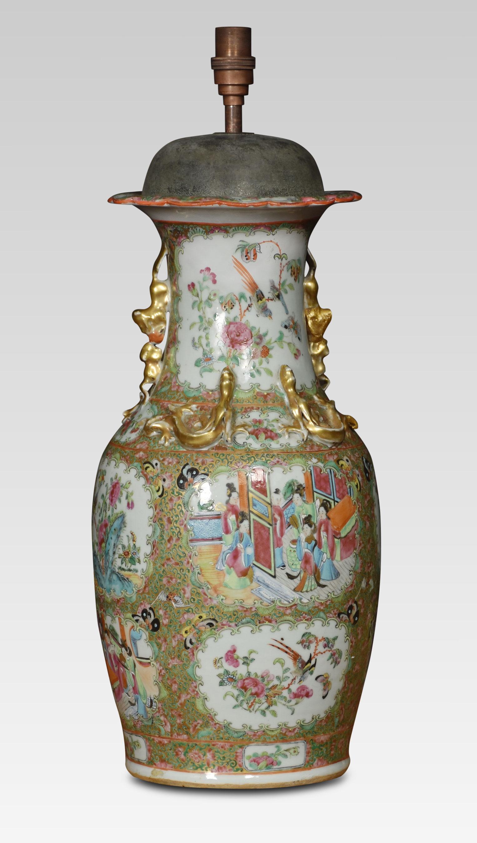 Cantonese twin-handled baluster vases lamp, decorated in the famille rose palette with cartouche panels of figures, exotic birds and insects amongst the foliage. Raised up on a circular base.
Dimensions
Height 22 Inches
Width 8.5 Inches
Depth