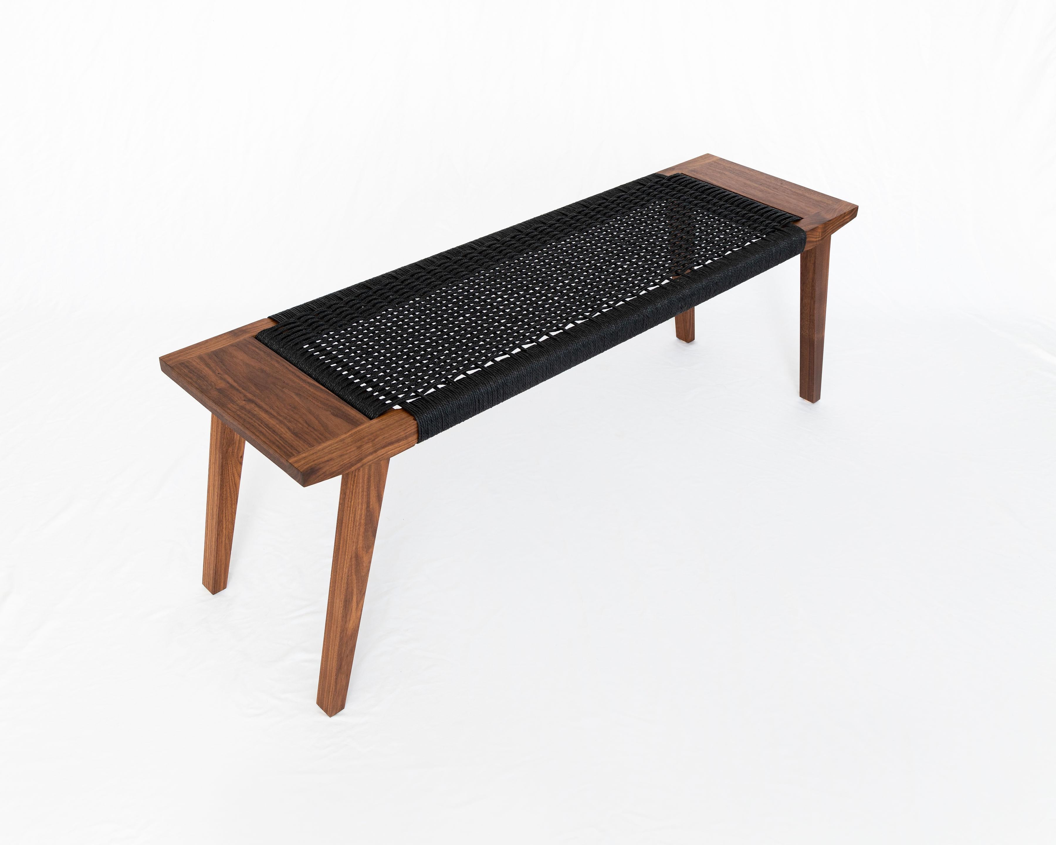 Featuring woven paper cord, walnut, and modest tapers, the Canva bench explores a love for material and craftsmanship welded with warm welcome. Constructed with a mortice and Tenon frame and handwoven seat, the Canva bench is artisan-crafted from