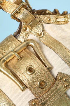 Canvas and gold leather hand-bag with belt and buckle Louis Vuitton "Inventeur"