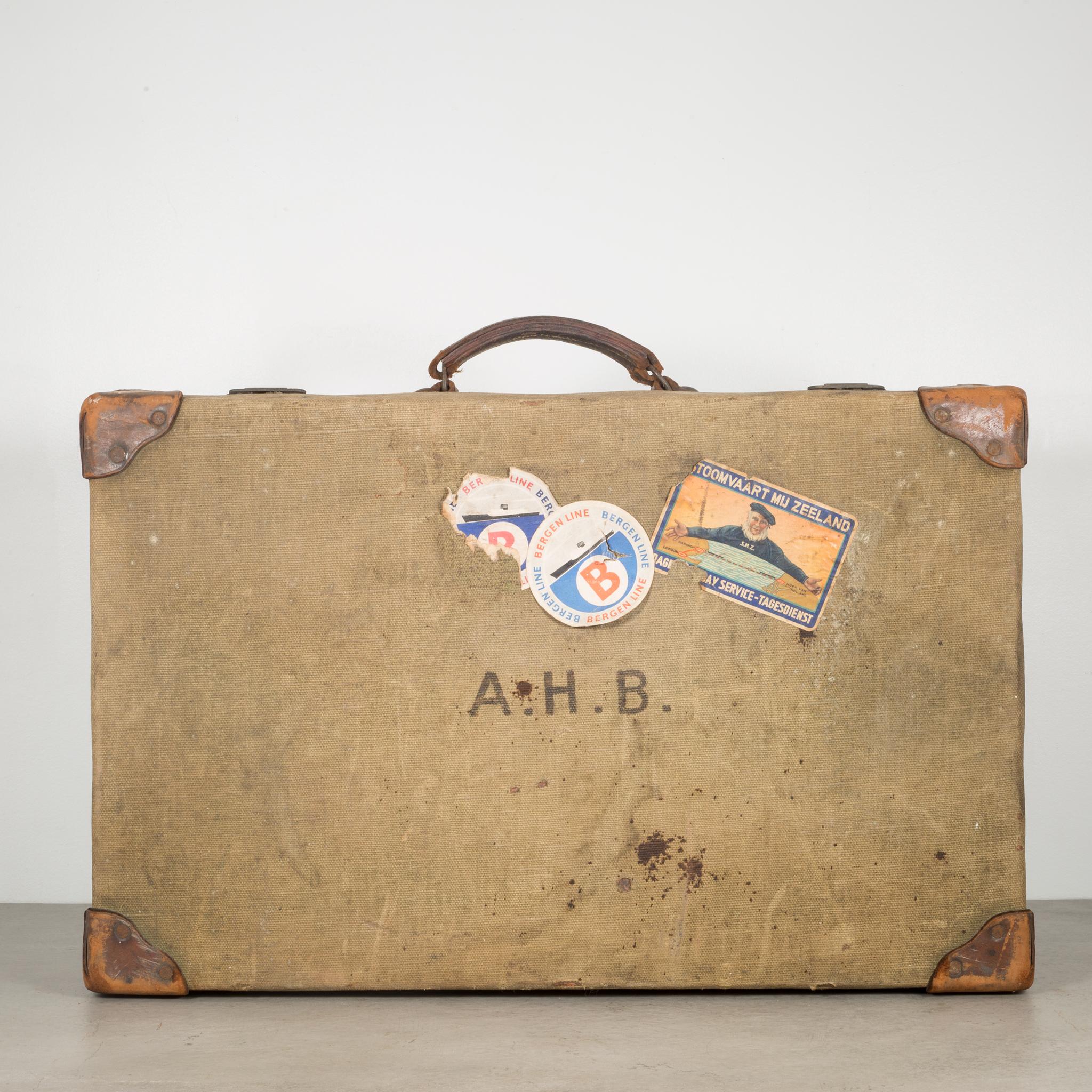 About

This a vintage canvas suitcase with leather handle and corners and original travel stickers. The locks are brass and open properly. The suitcase is monogrammed 