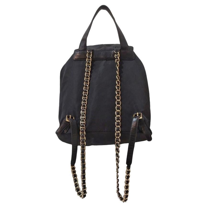 Canvas Black color Leather inserts Golden chain shoulder straps Buckle closure Internal zip pocket Cm 31 x 25 x 13 (1220 x 984 x 511 inches)
