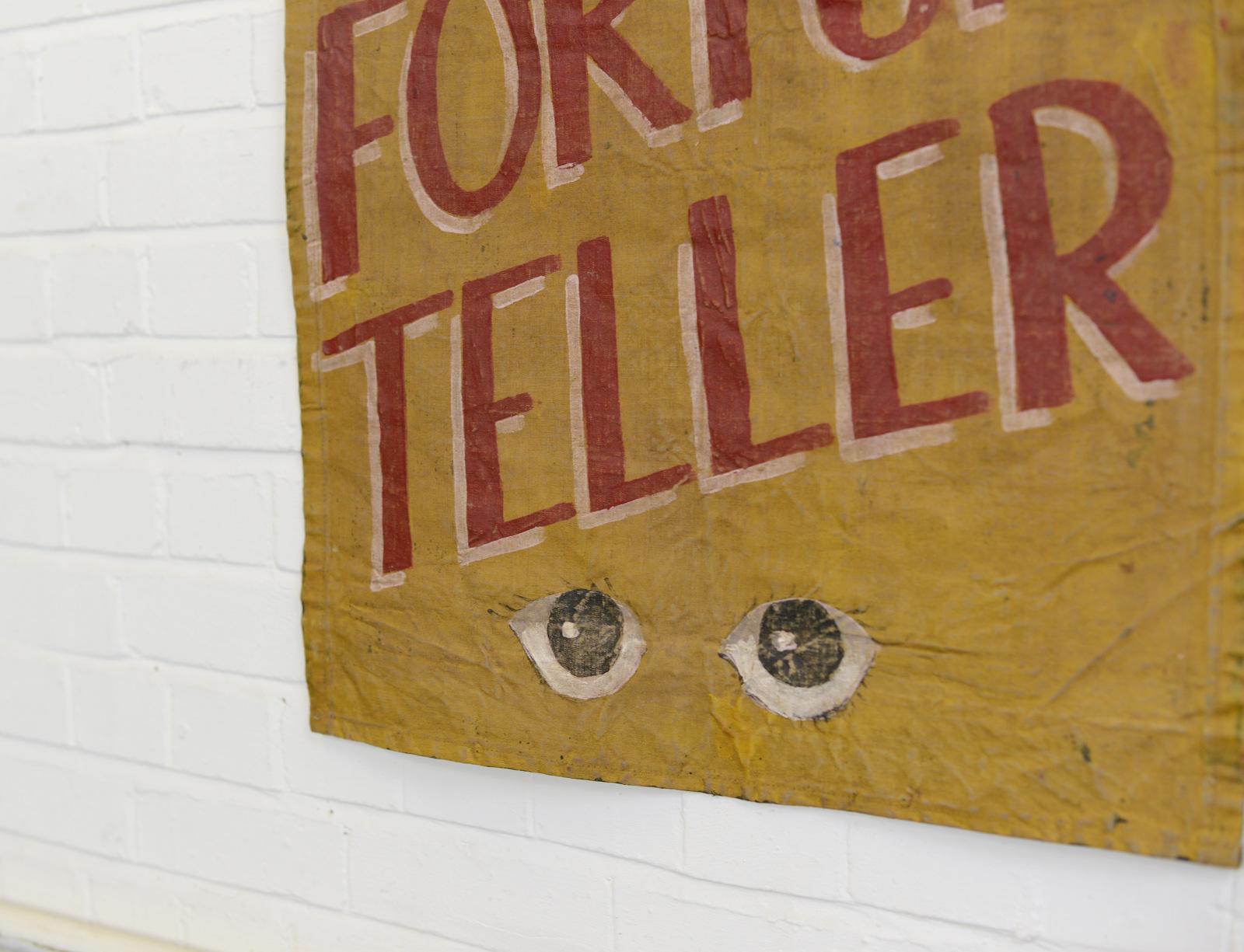 Canvas fortune teller sideshow banner, circa 1950s

- Hand painted on wax canvas
- Mustard yellow background 
- Red lettering
- English, 1950s
- Measures: 66cm wide x 92cm tall.

Condition report:

Some light creasing and age marks.
 