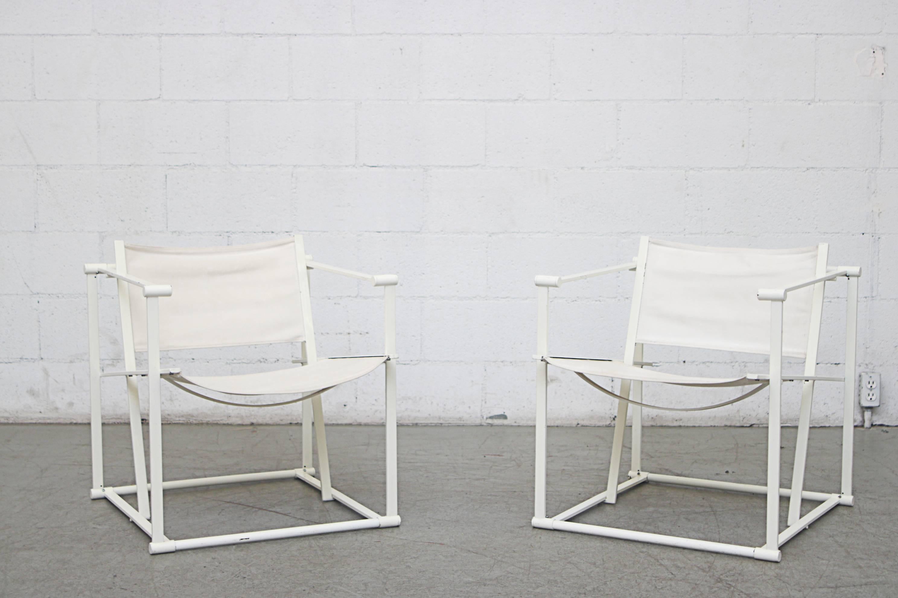 UMS Pastoe FM60, Cubic chair lounge chair, designed in 1980 by Radboud van Beekum. White enameled steel frame with original worn white-ish canvas seating. Visible wear with some fraying and fading of canvas. Frame are in original condition with