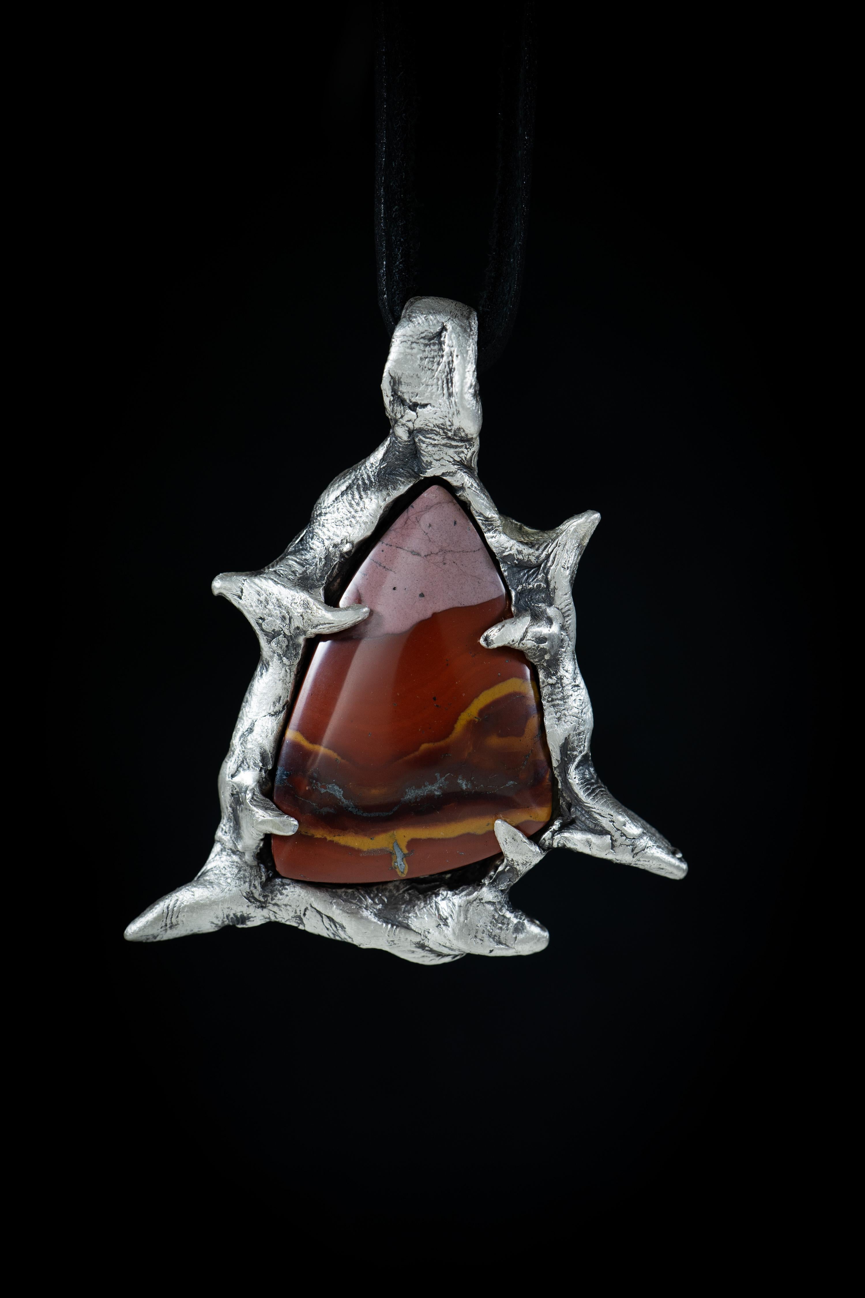 Canyon and the Star is a one-of-a-kind pendant by Ken Fury that is hand-carved and cast in sterling silver and features a natural Red & Green Blanket Jasper from Peru.

Size of piece: 58mm x 50mm

Hand-signed

Includes a leather cord, send a message