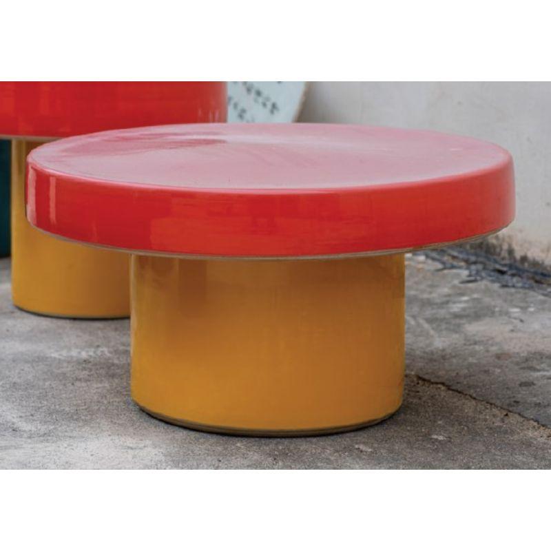 Cap low table with red and yellow glazes by WL CERAMICS
Design: Lex Pott
Materials: Porcelain, glossy red and yellow glazes
Dimensions: H 30 x Ø 59 cm.

Also available in different dimensions and different colored glazes.

The CAP tables