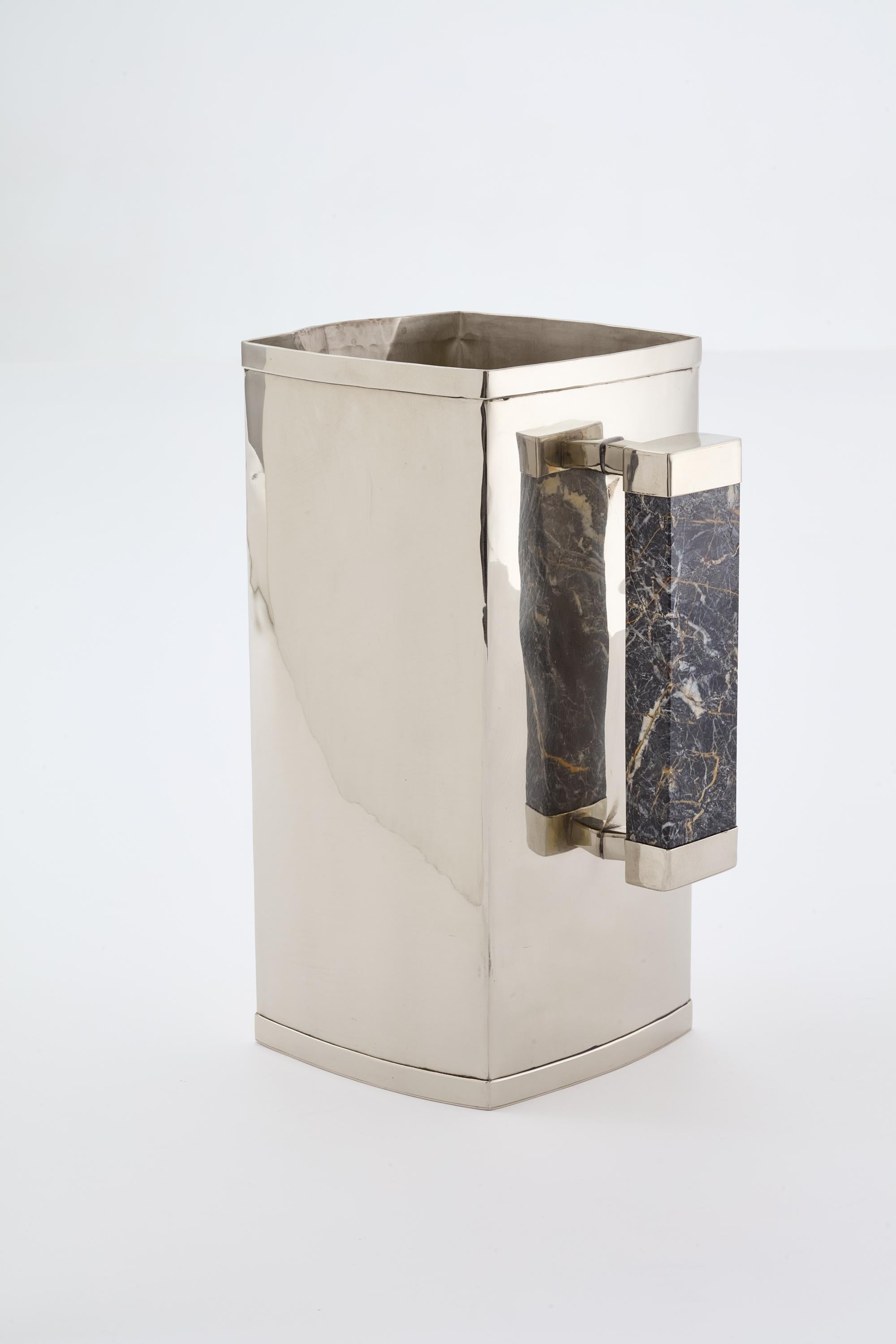 With the concept of intermingle materials from our earth, soft marbles and manually hammered alpaca, this sophisticated and elegant line is created, and it includes trays, champagne buckets and pitchers in different forms and sizes.

Our pieces are