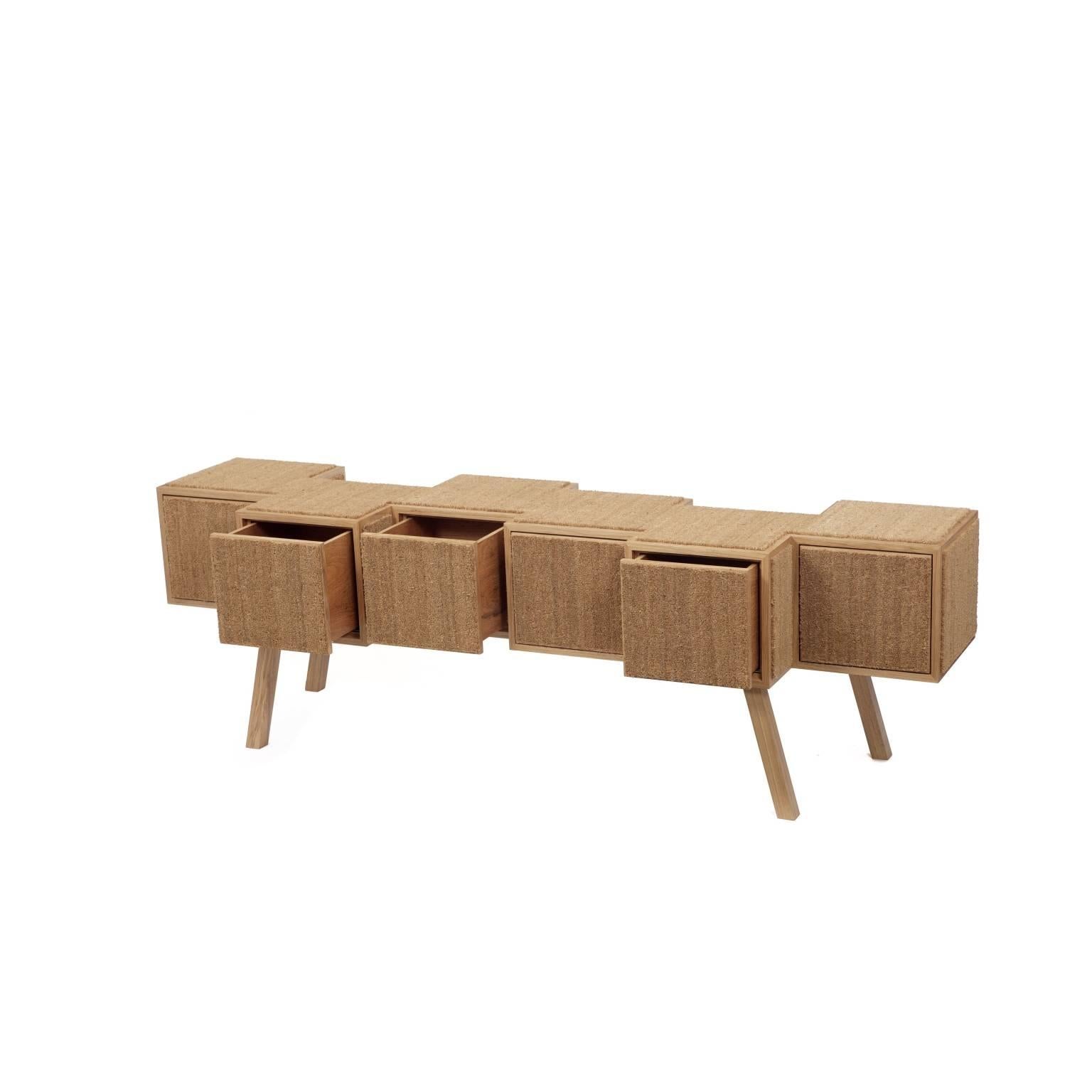 This contemporary buffet or credenza is finished with Louro Freijó veneer and coconut fiber mat.

The buffet or credenza is the result of artisanal production process, which makes it extremely unique. Therefore, any irregularities should not be