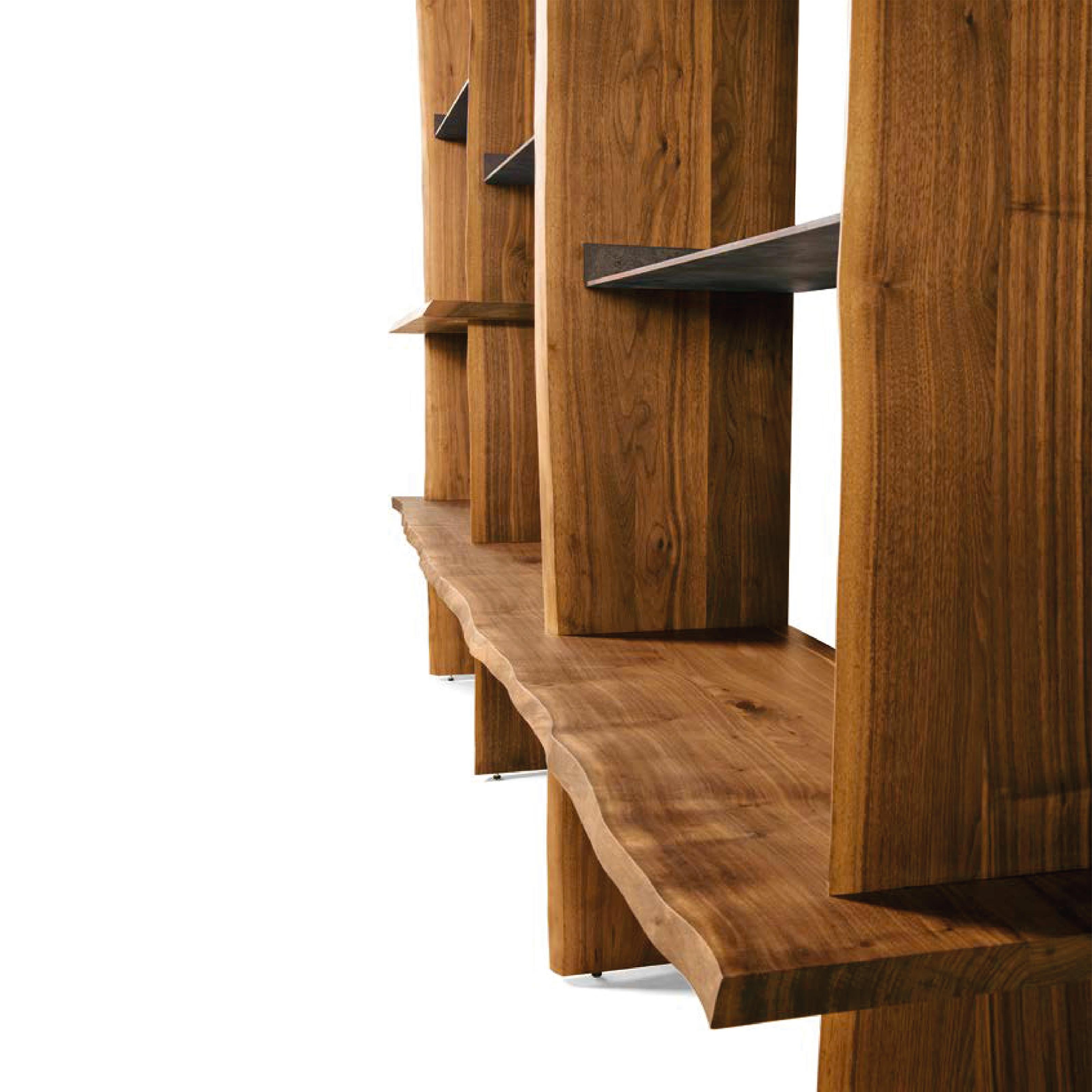 Capanna is a wall bookcase equipped with shelves and support floors and made of precious canaletto walnut finished with acrylic. The Italian artisan tradition is reinterpreted in a contemporary design to create a refined piece of wooden furniture.